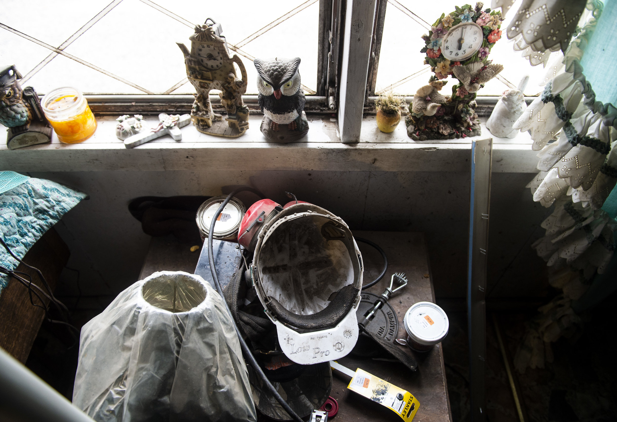  The coal miners helmet that Harold Dotson wore when he worked in the mines sits on a table near the front window of his home in Paw Paw, Kentucky on Thursday, January 17. 