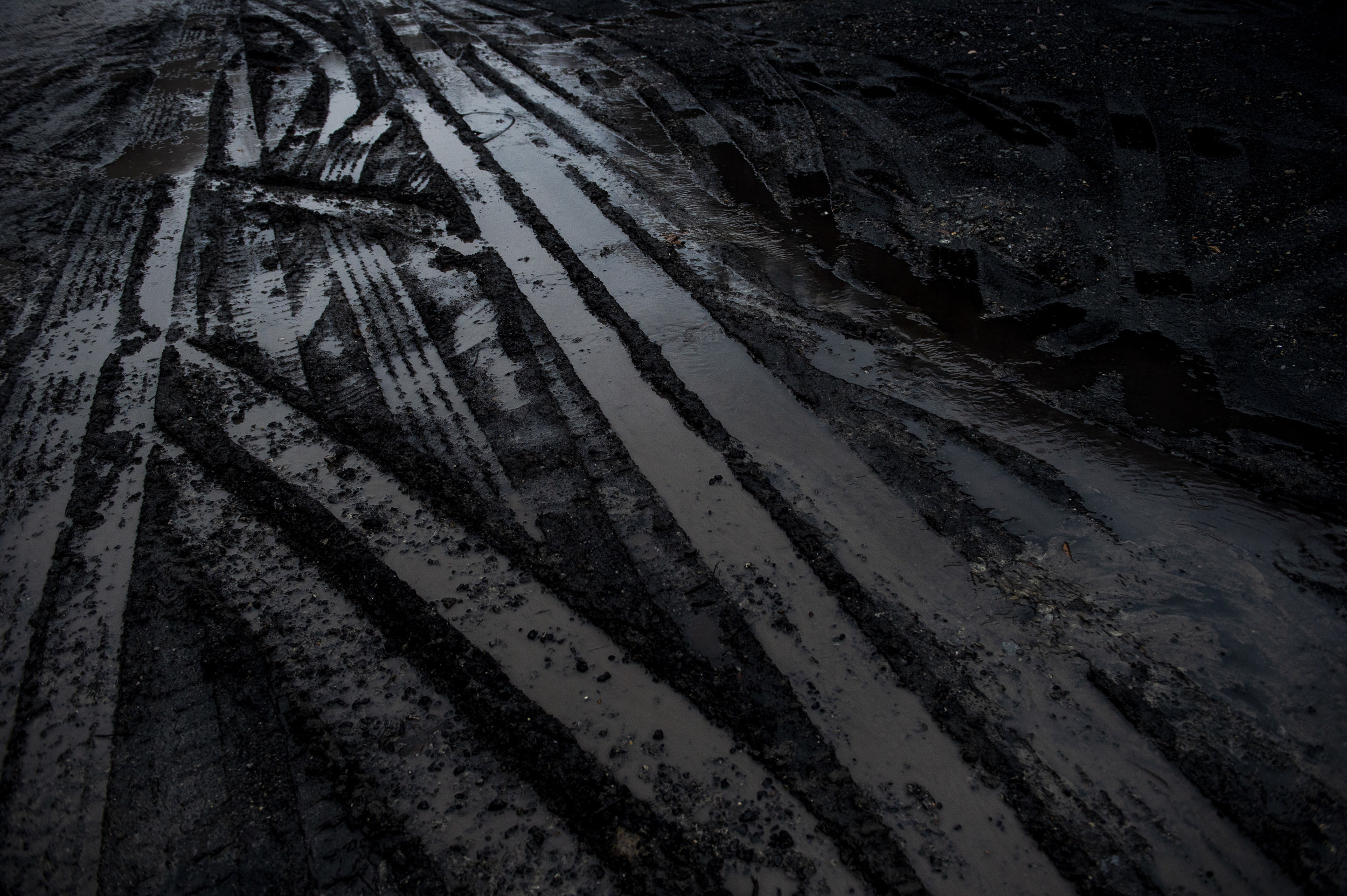  A parking lot covered in coal near a coal processing plant outside of Pikeville, Kentucky. 