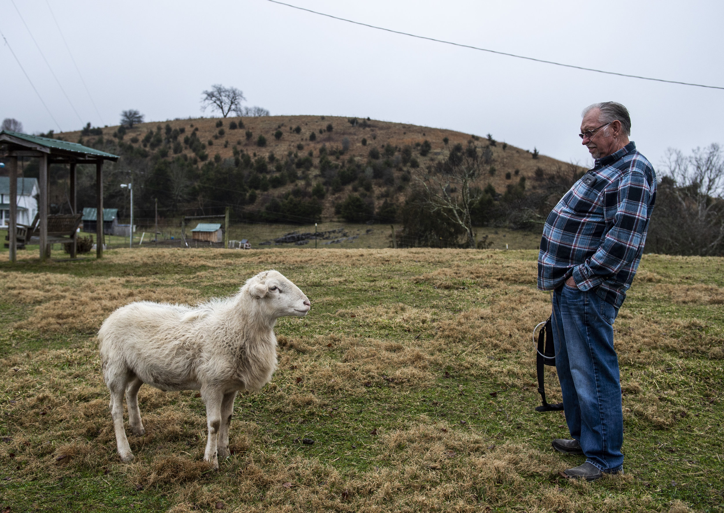  Paul Kinder and one his rams share a moment on his homestead on the outskirts of Honaker, Virginia on Friday, January 18. Paul, who worked in the mines since he was a teenager, lives with Black Lung Disease. While it limits his mobility, he makes it