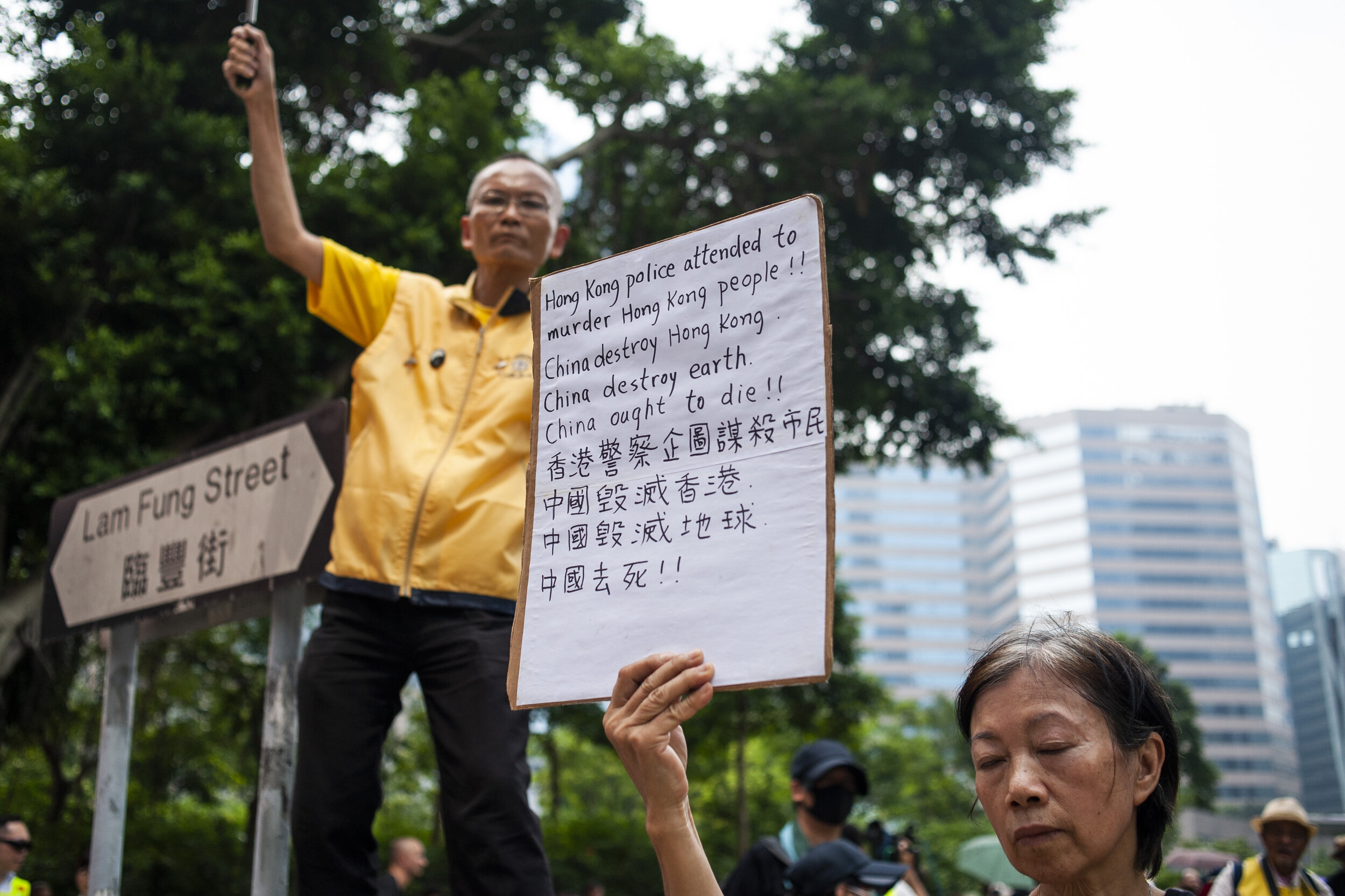  Pro-democracy protesters hold signs during a march in Kwun Tong against police surveillance and the introduction of ‘smart light poles’ which use facial recognition technology on August 24, 2019. The march later turned into a stand-off with riot pol