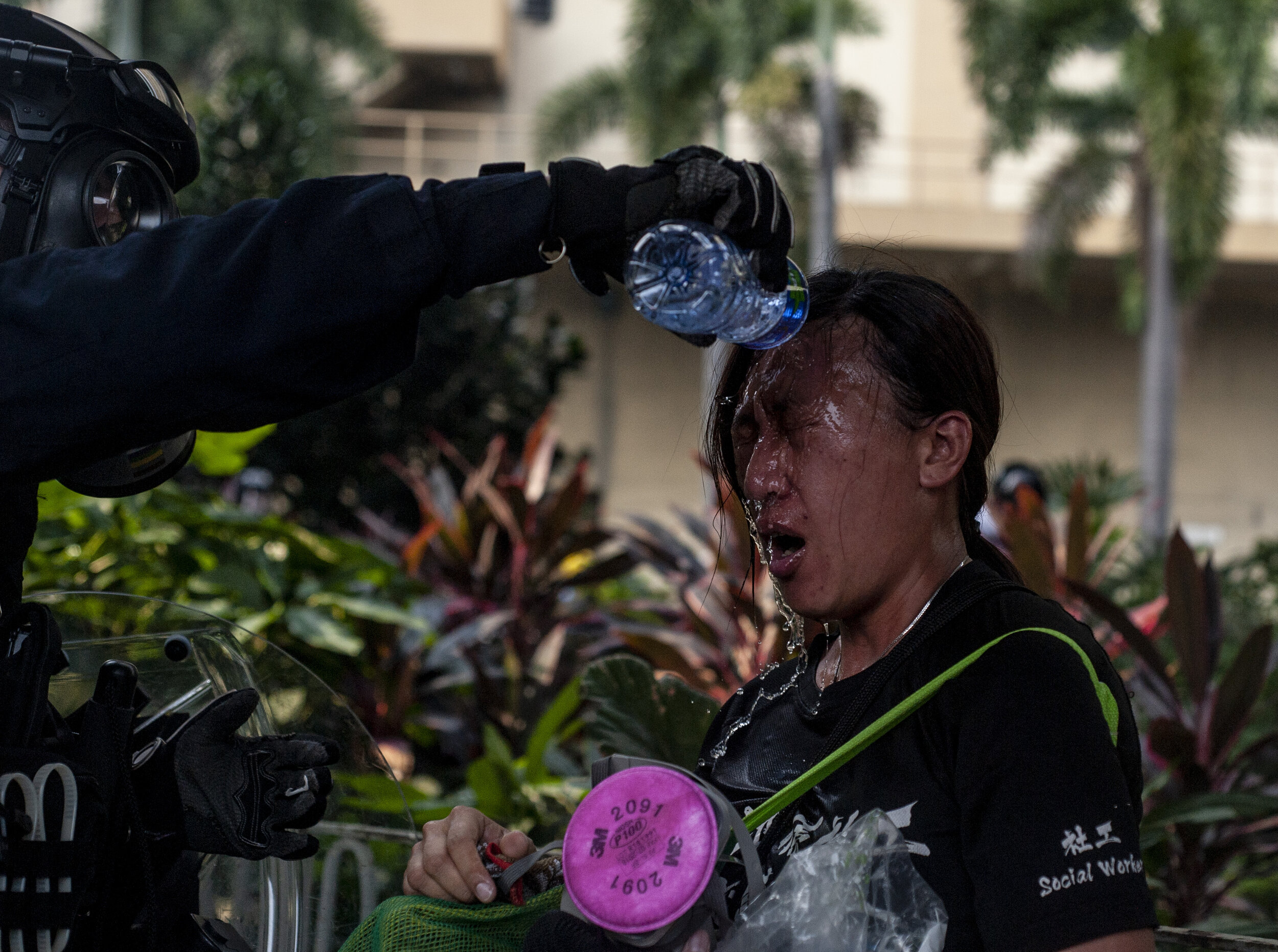  A police officer washes out a protester’s eyes after she was sprayed point blank with pepper spray during heavy clashes between police and protesters in Kwun Tong on August 24, 2019. Police expended hundreds of tear gas canisters as they fought to p