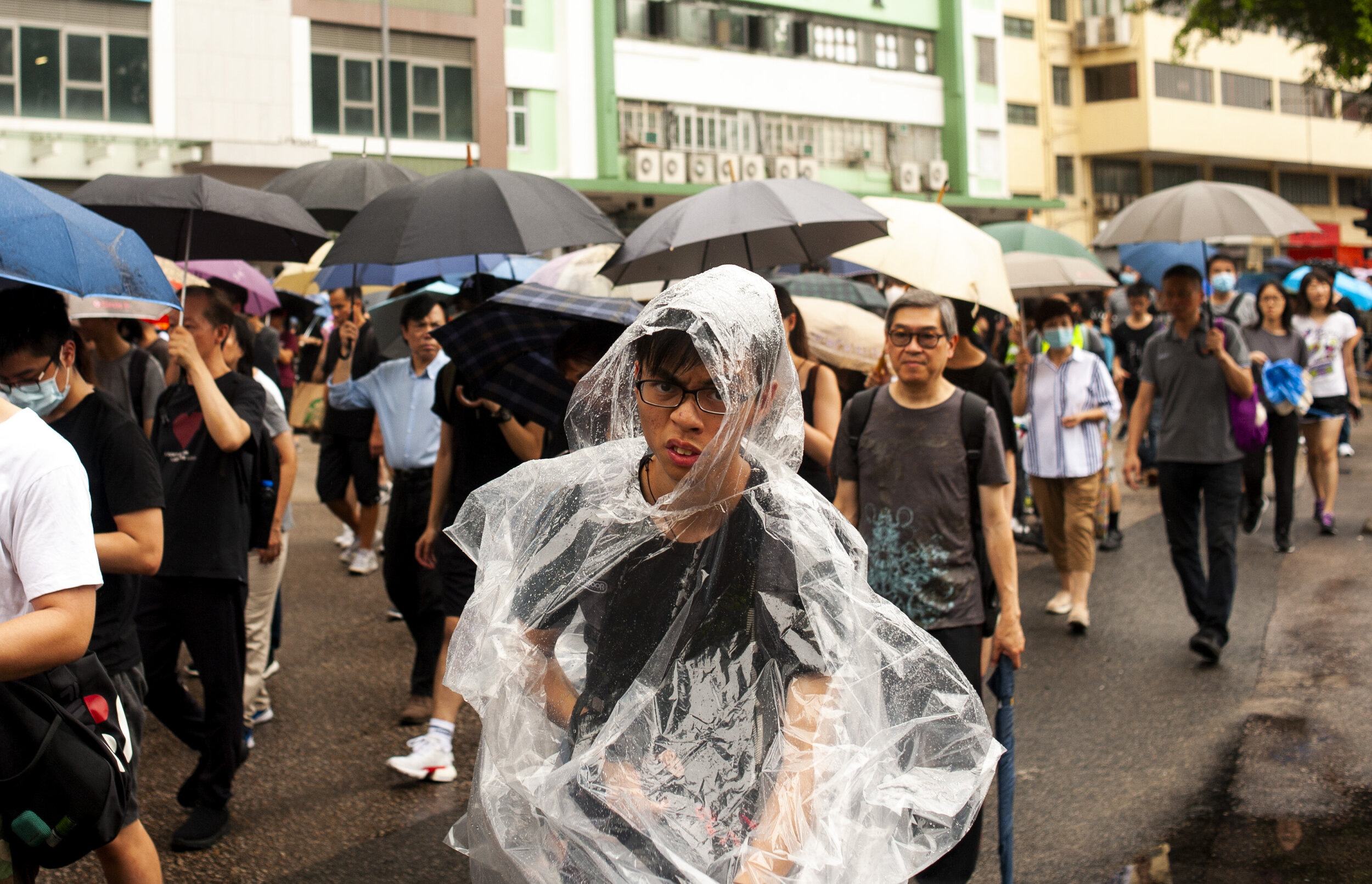  A pro-democracy protester marches with thousands of other protesters during a teacher’s march in Hung Hom against the extradition bill on August 17, 2019. Protesters shouted at police officers who lingered in vans nearby however, the police and prot