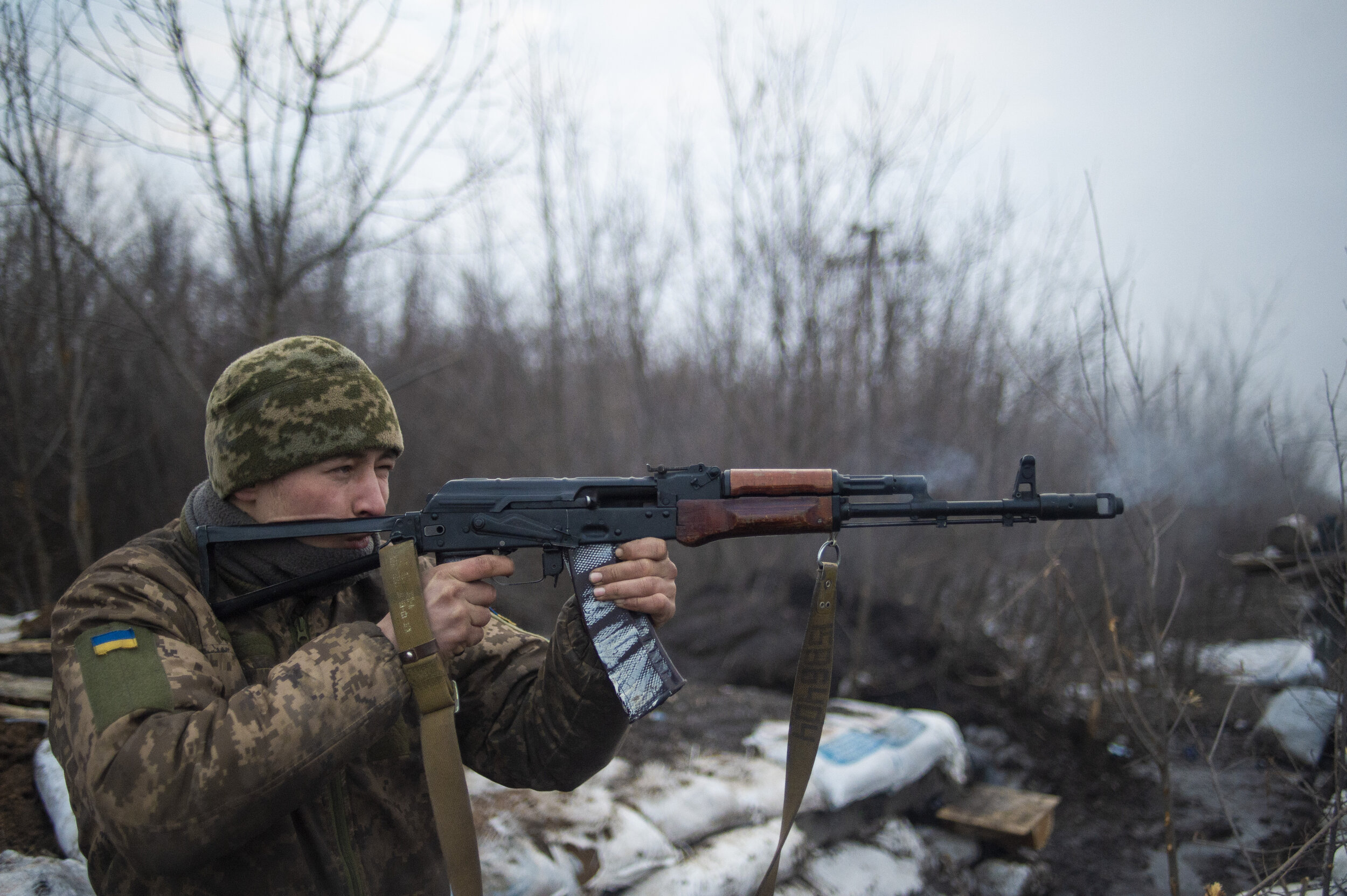  A Ukrainian soldier fires his rifle on the frontline position of ‘Point Zero’ in Zolote-4 after a night of sporadic mortar shelling on Ukrainian military positions on February 29, 2019. ‘Good morning’ shots are a staple of frontline life, both sides
