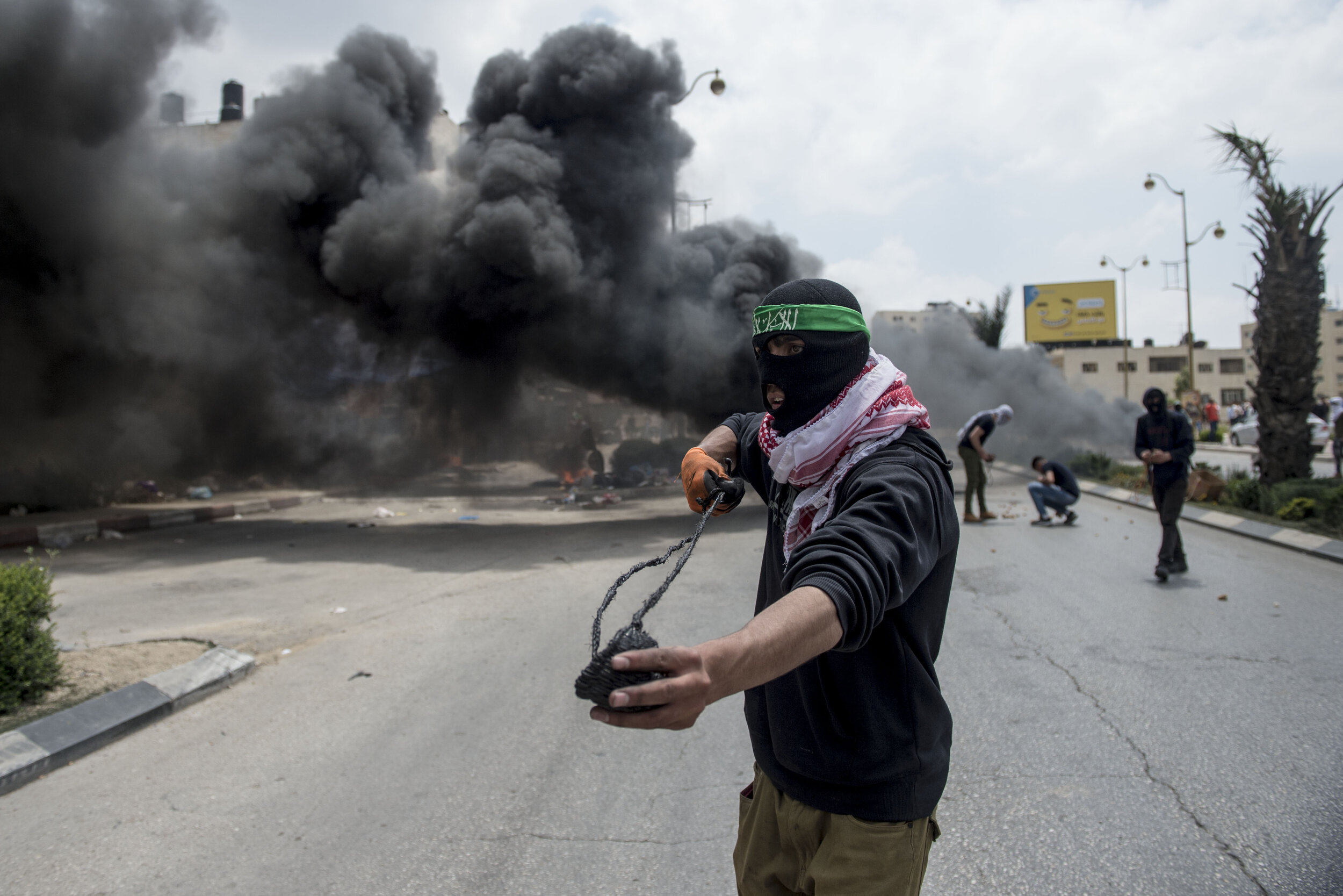  A Palestinian protester readies a rock in his sling during heavy clashes at Beit-El on Nakba Day. Nakba Day is the Palestinian Day of mourning and is also called ‘Day of the Tragedy’ as it commemorates the day in which the West Bank was annexed and 