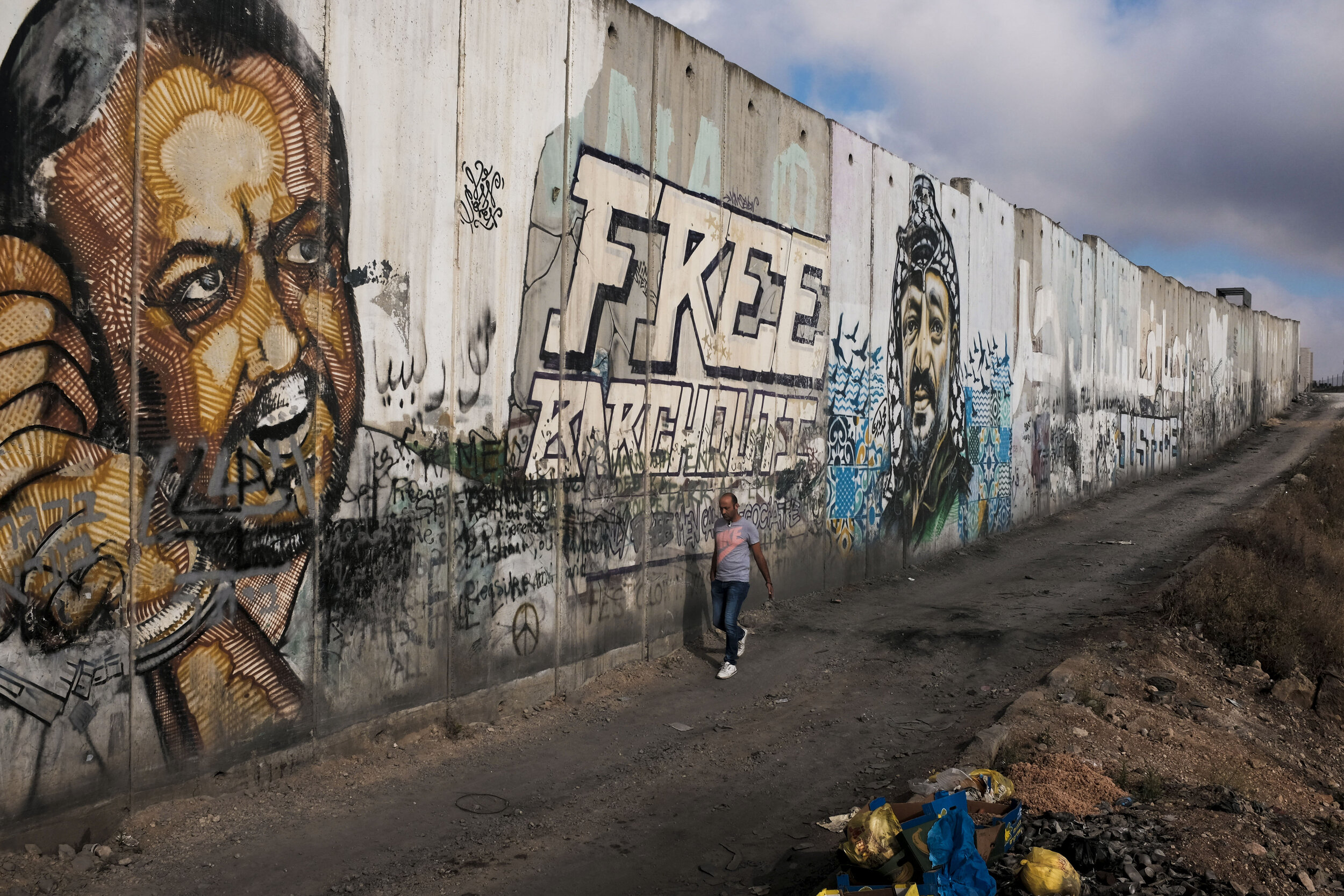  Murals of political prisoners and former leaders adorn the giant stone wall which separates Israel from the Occupied West Bank near Qalandia Checkpoint.  