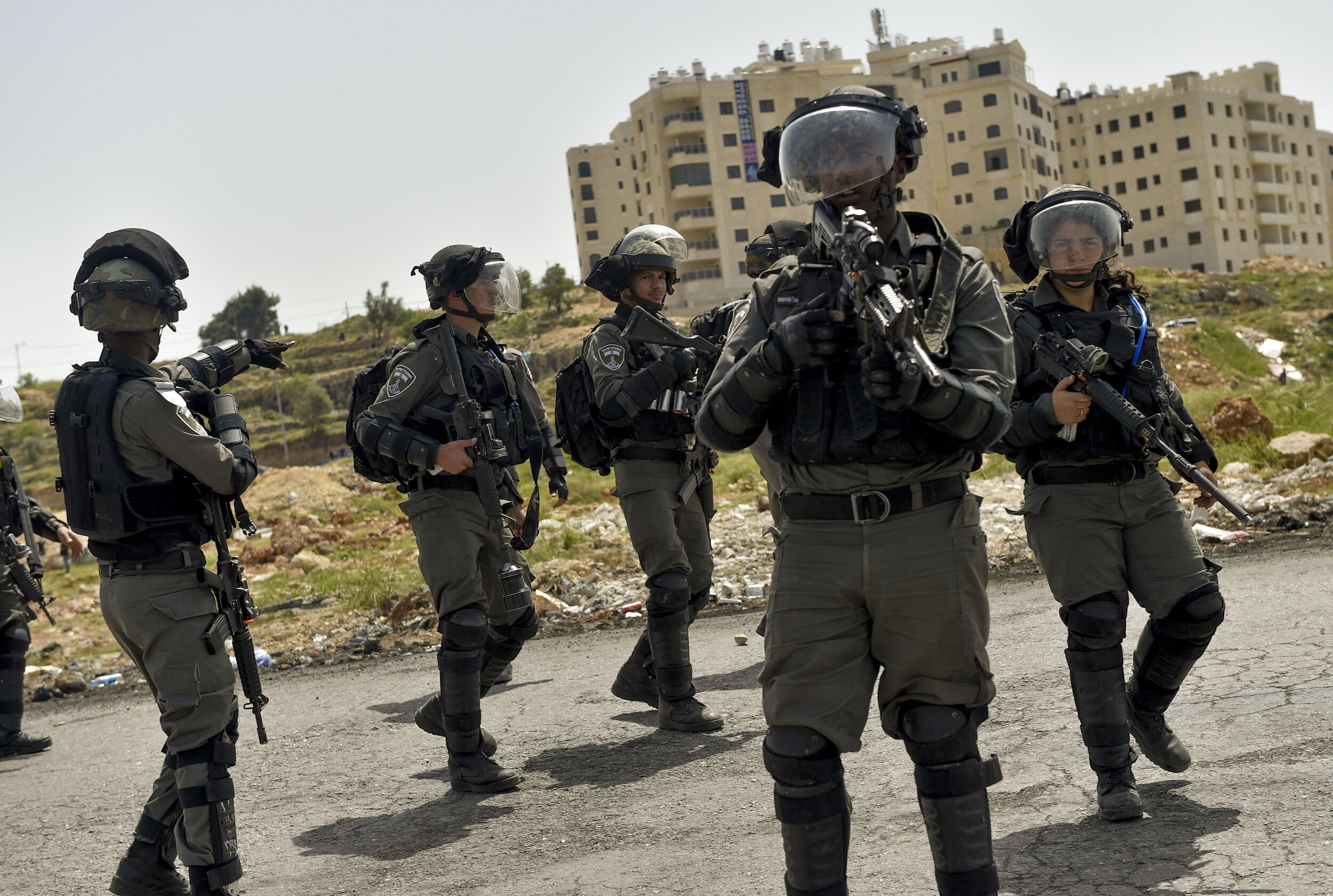  Israeli soldiers clear a street with flashbangs and rubber bullets as they fight to quell a particularly violent clash near Beit-El in the Occupied West Bank. 