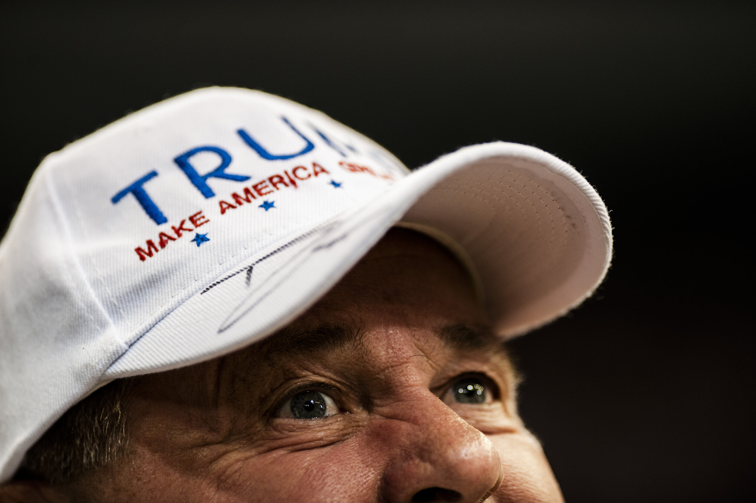  A Trump supporter listens intently to President Donald Trump as he speaks at a rally in the US Bank Arena in Cincinnati, Ohio on August 1, 2019. 