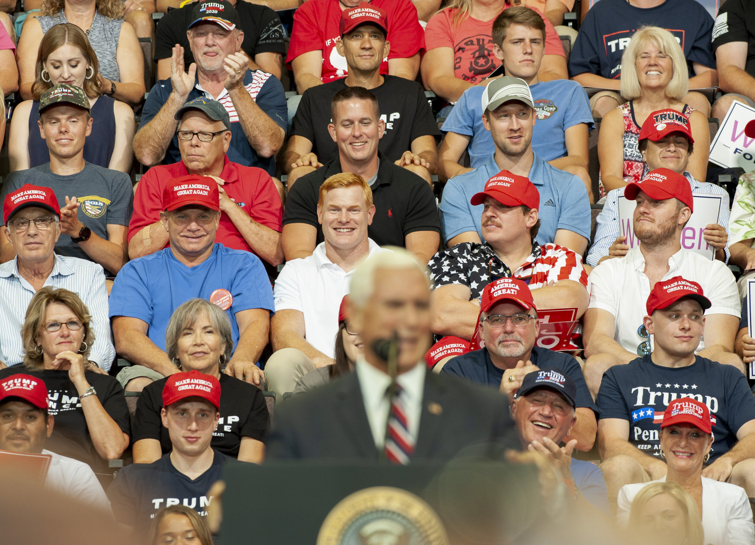  Attendees to the Trump rally in Cincinnati, Ohio listen to a speech by Vice President Mike Pence on August 1, 2019. 