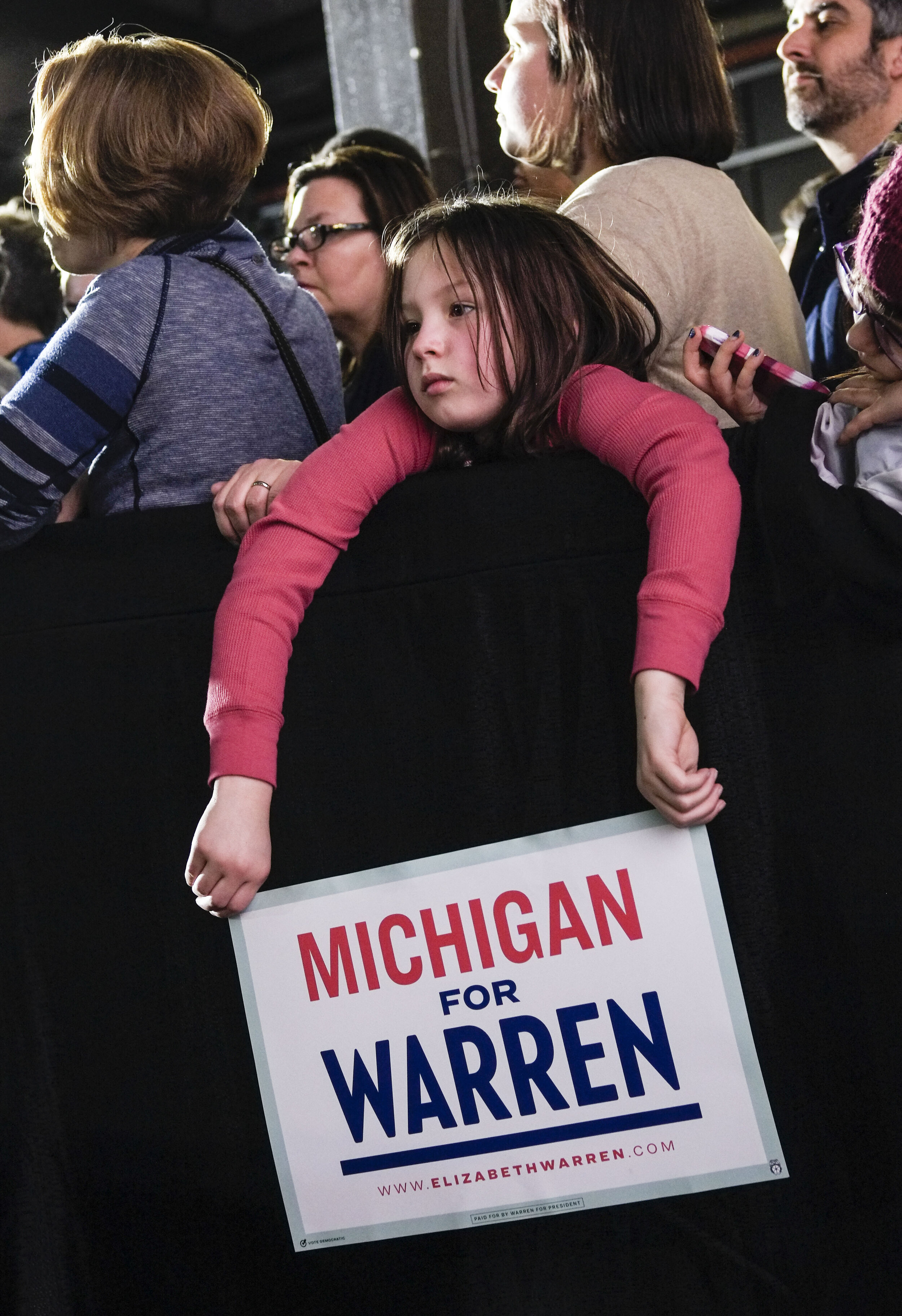  A young girl waits for Democratic candidate Elizabeth Warren during a campaign rally in Detroit, Michigan on March 3, 2020. 