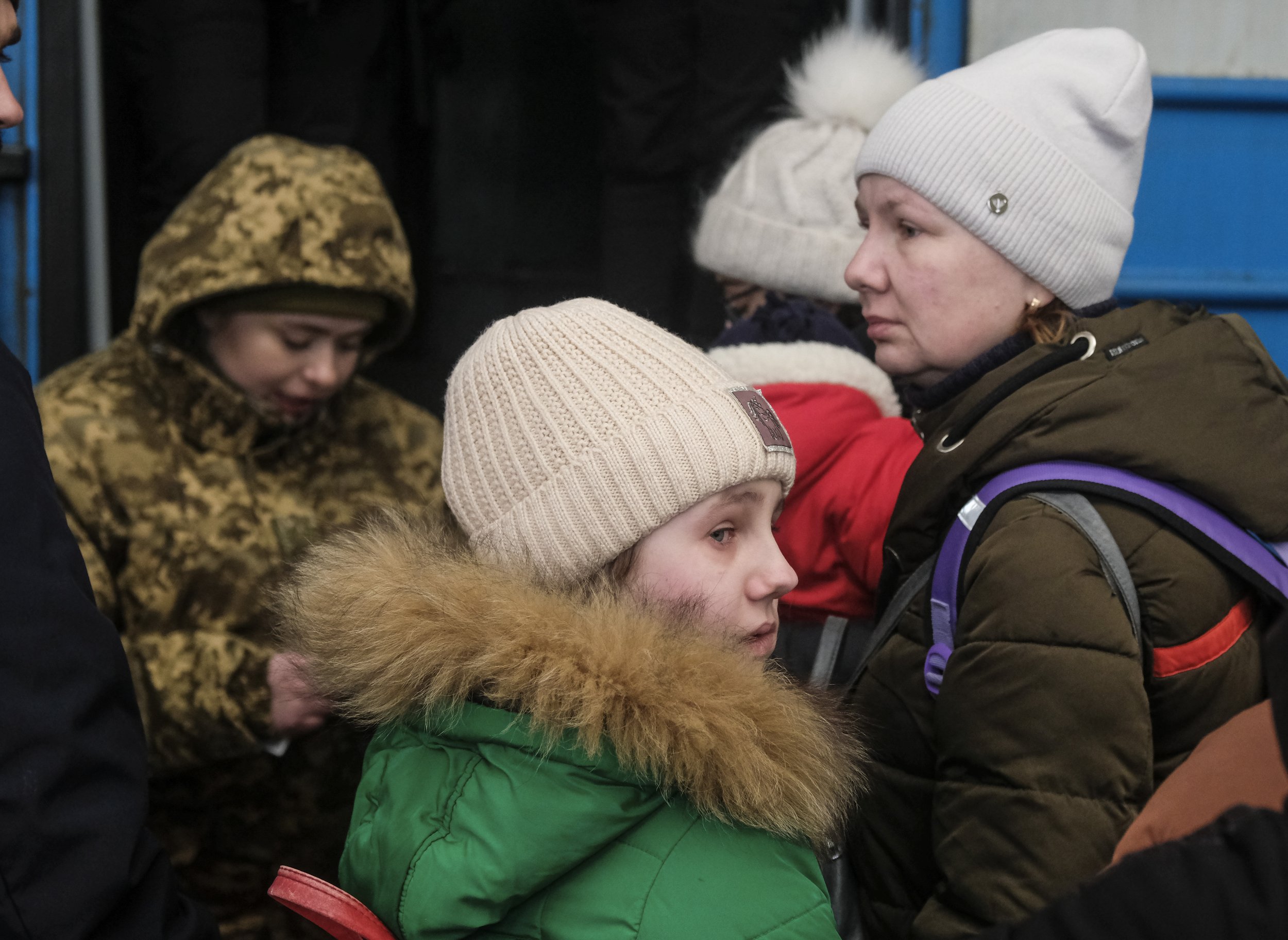  A young girl cries as she waits to board a train with her mother and siblings headed to the Polish border at the Lviv-Holovnyi railway station in Lviv, Ukraine on March 11th, 2022. Hundreds of thousands of Ukrainian civilians pass through the rail s