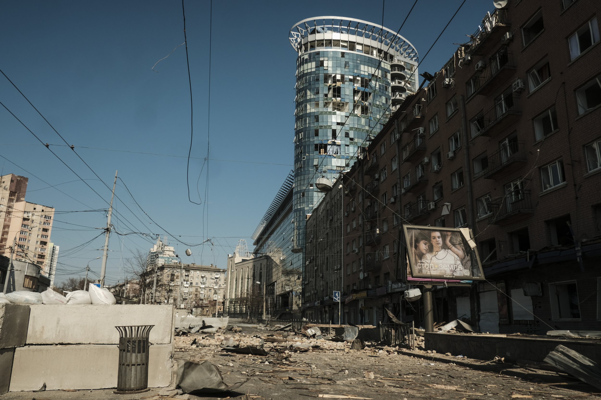  A street is littered with glass and debris following a Russian missile strike on a shopping district in Kyiv, Ukraine on March 15, 2022. Missile attacks on Kyiv claimed the lives of civilians and soldiers alike as Russia attempted to encircle the ci