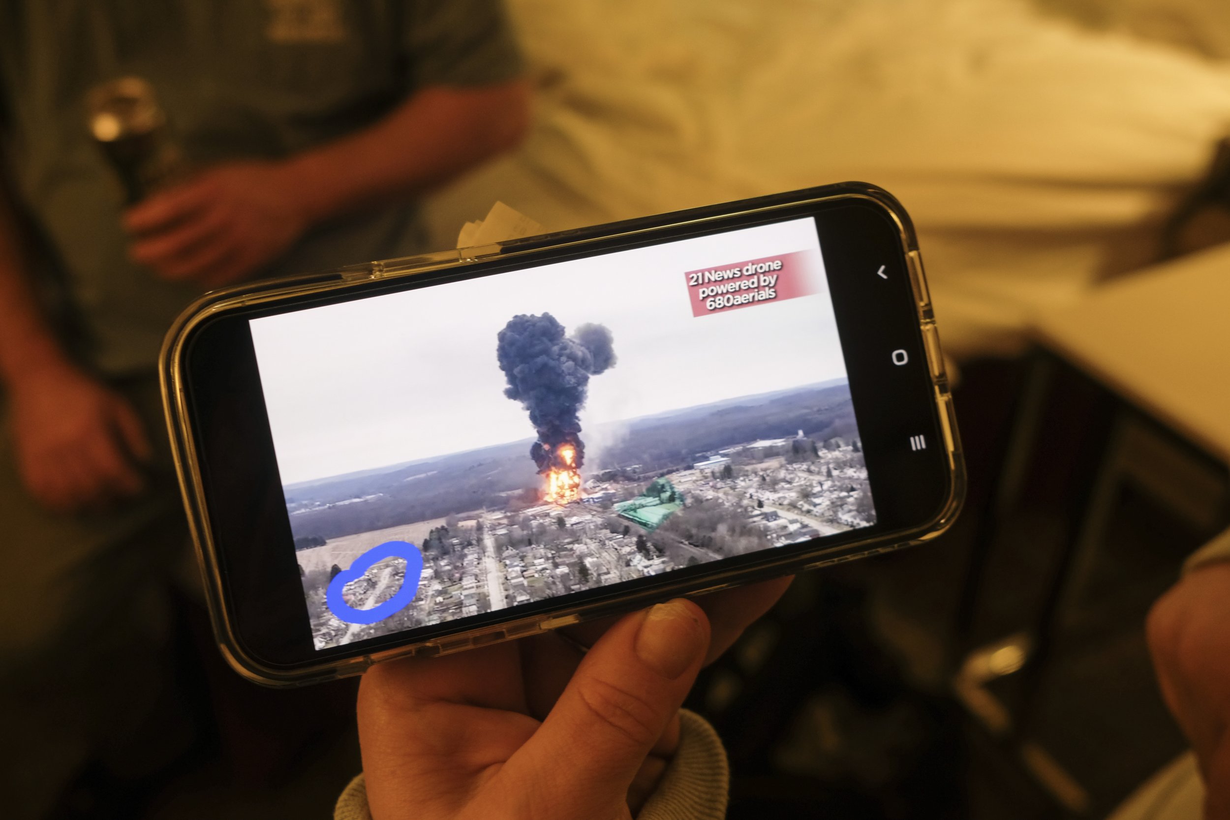  Nicole Bentel shows a screen grab of the smoke plume that resulted from the controlled burn of toxic chemicals such as Vinyl Chloride after the derailment of a Norfolk Southern train on the outskirts of East Palestine, Ohio while they stay at their 