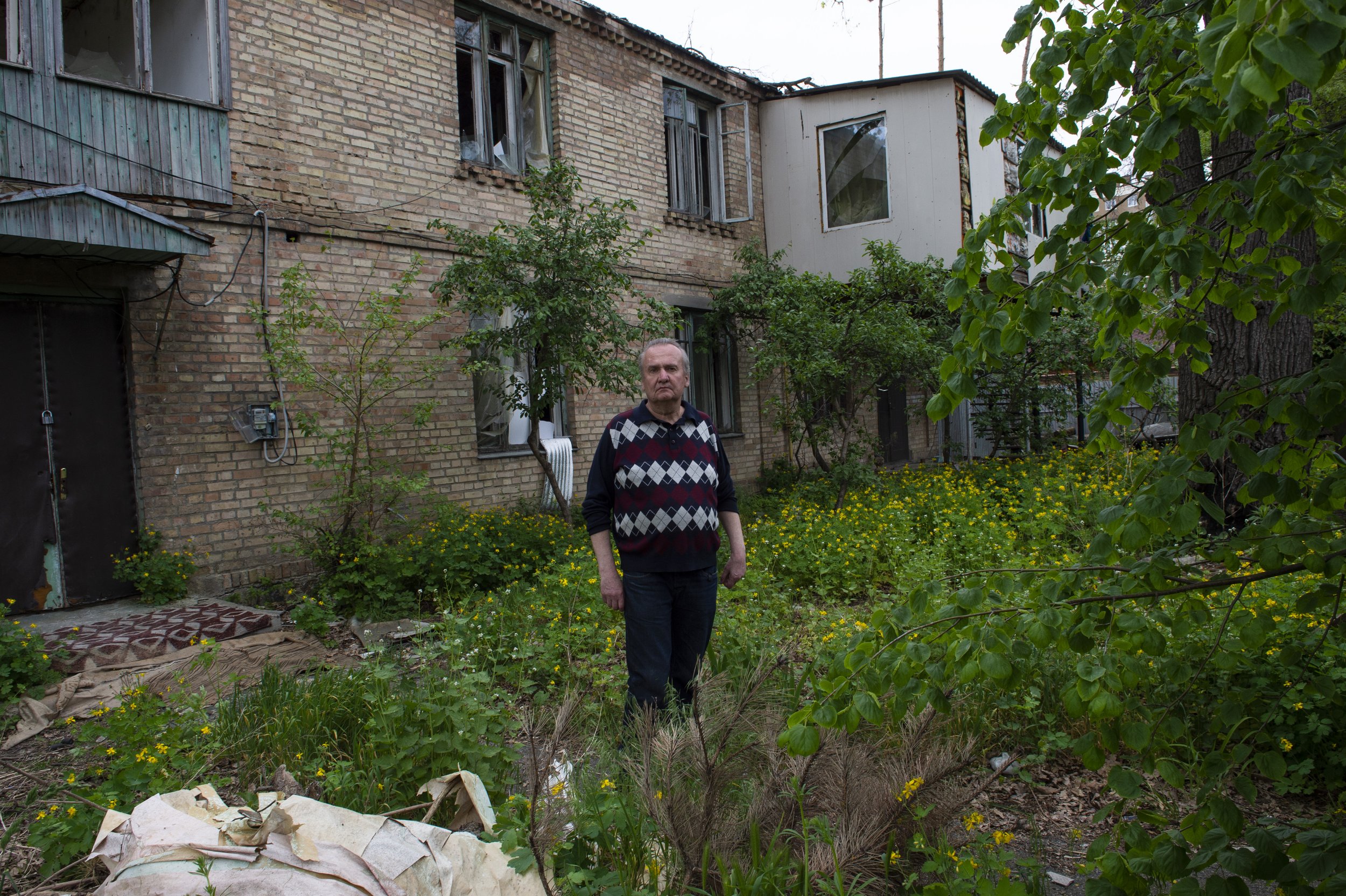  Yehor, a resident of Irpin, poses for a portrait in the yard of his destroyed home on May 18, 2023. Irpin and other suburbs of Ukraine were the scenes of heavy fighting between Ukrainian and Russian troops in 2022, one year later much of the damage 