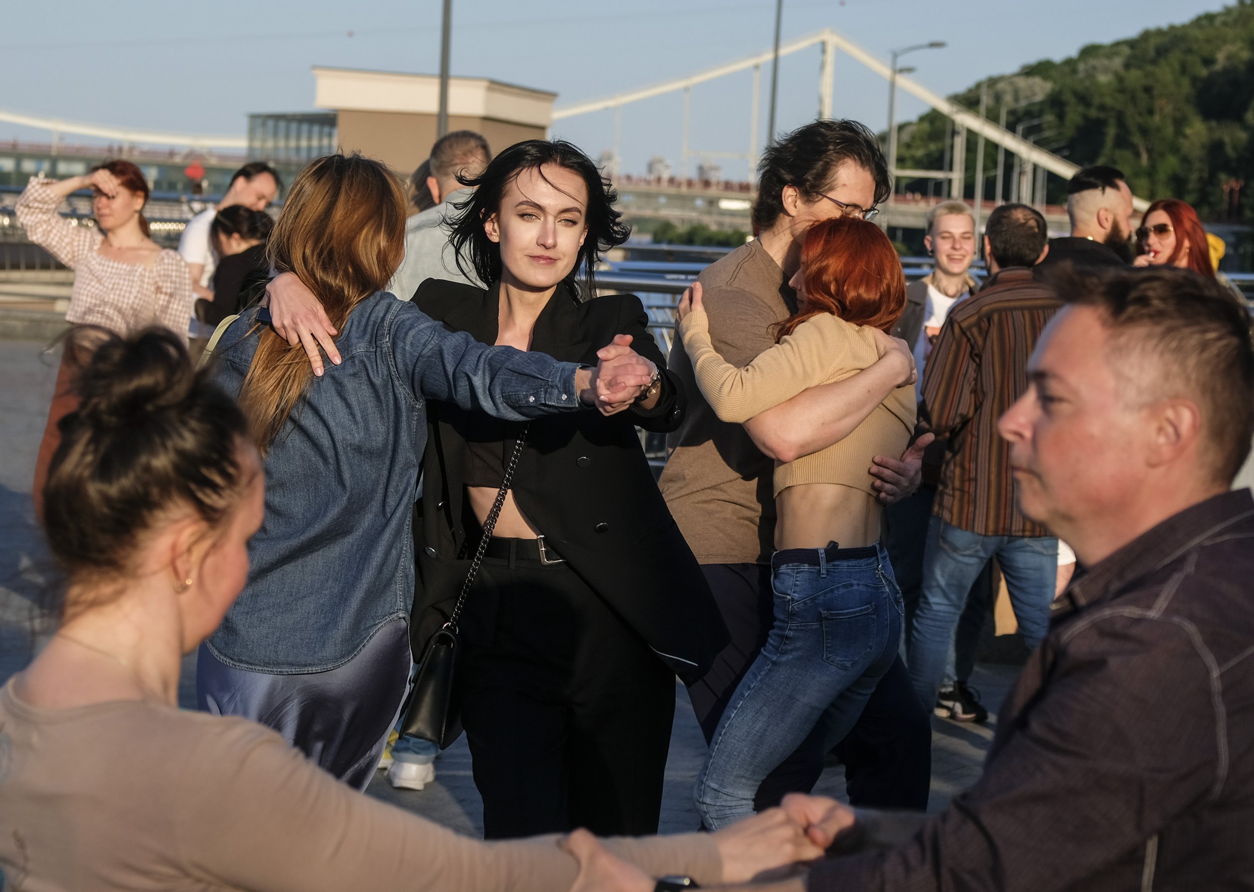  Residents of Kyiv dance during an outdoor dancing event along the Dnipro River on June 12, 2023. Ukrainians have begun to resume normal life a year after Russia’s full scale invasion despite the constant reminders of war all around. 