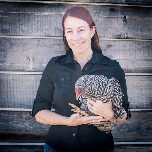 Urban Harvest STL founder Mary Ostafi (with Brie the chicken)