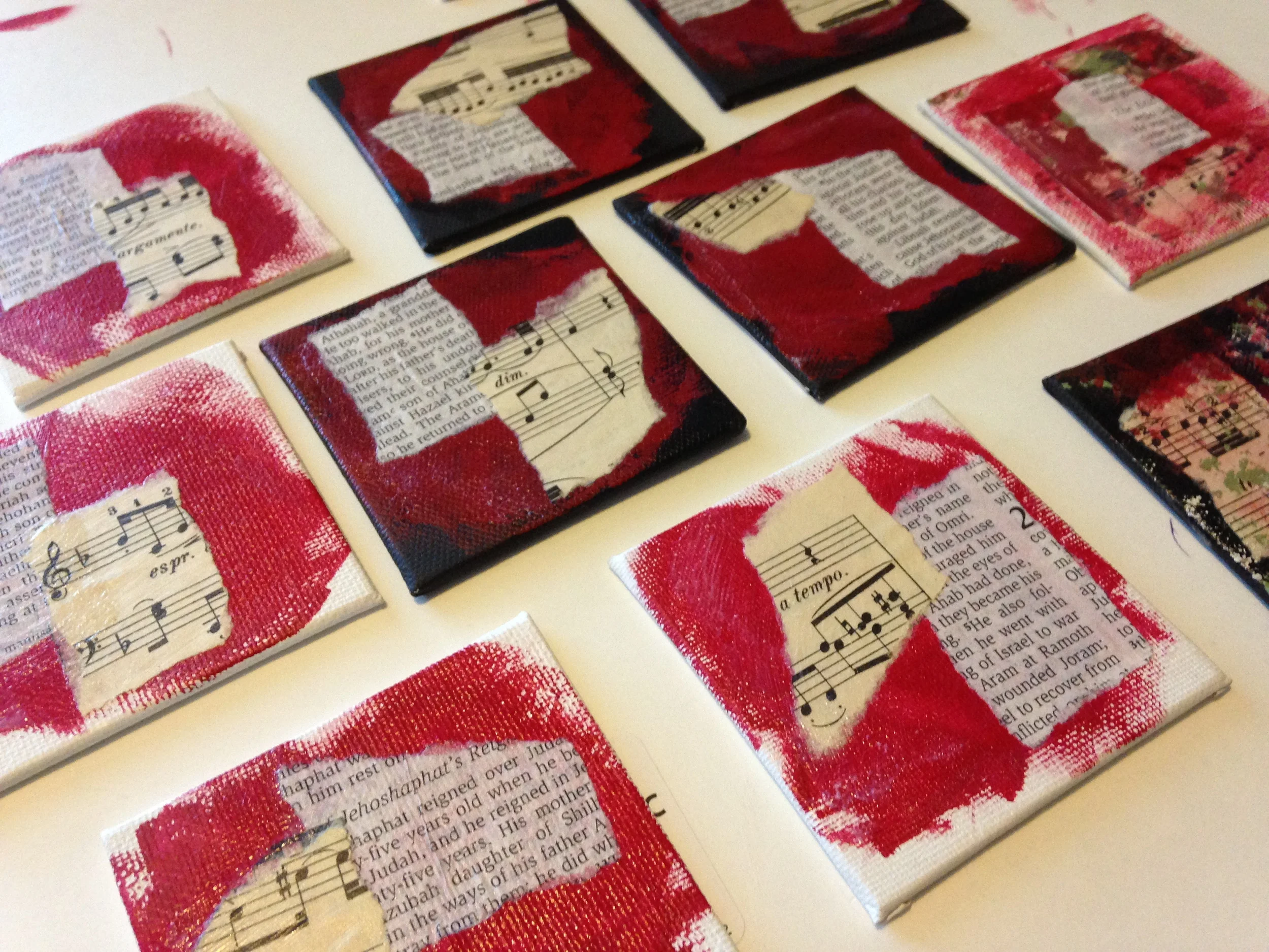 First steps: paint and collage elements, old sheet music and worn bible pages.