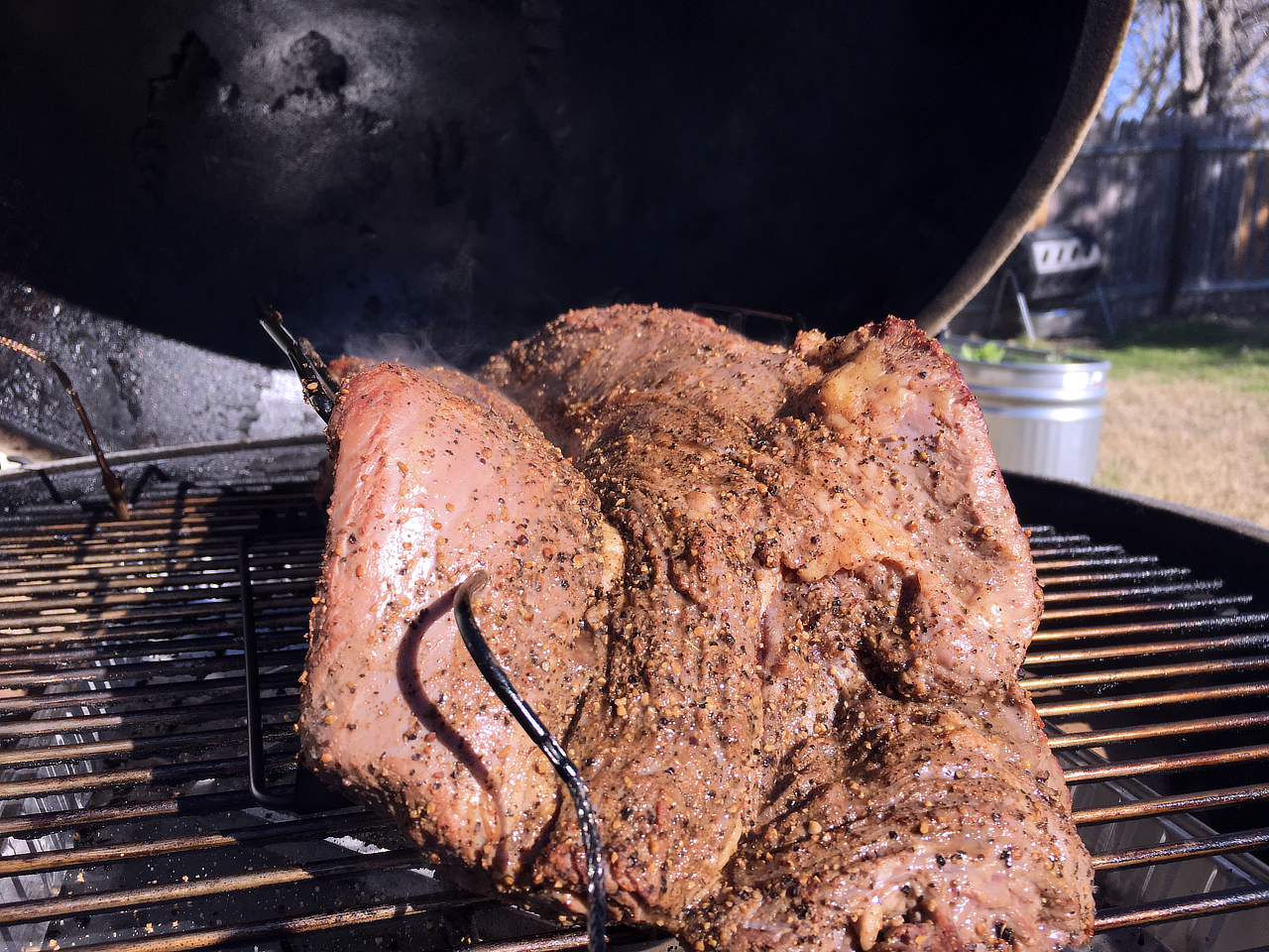 Rub applied, and placed on a V-rack on the Big Green Egg