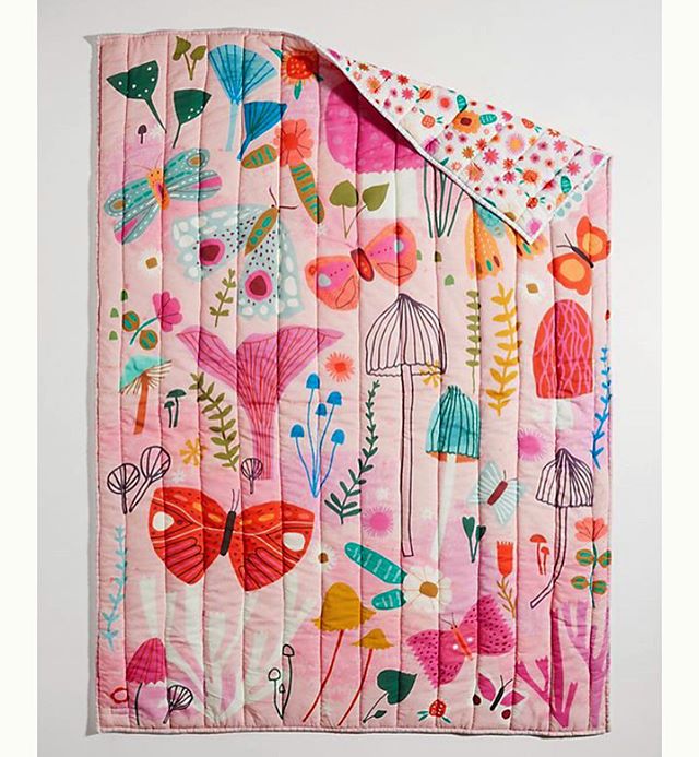 So in love with this quilt collaboration with @anthropologie 🍄🦋🌸 Swipe to see the rest of the children&rsquo;s bedding and a chair!