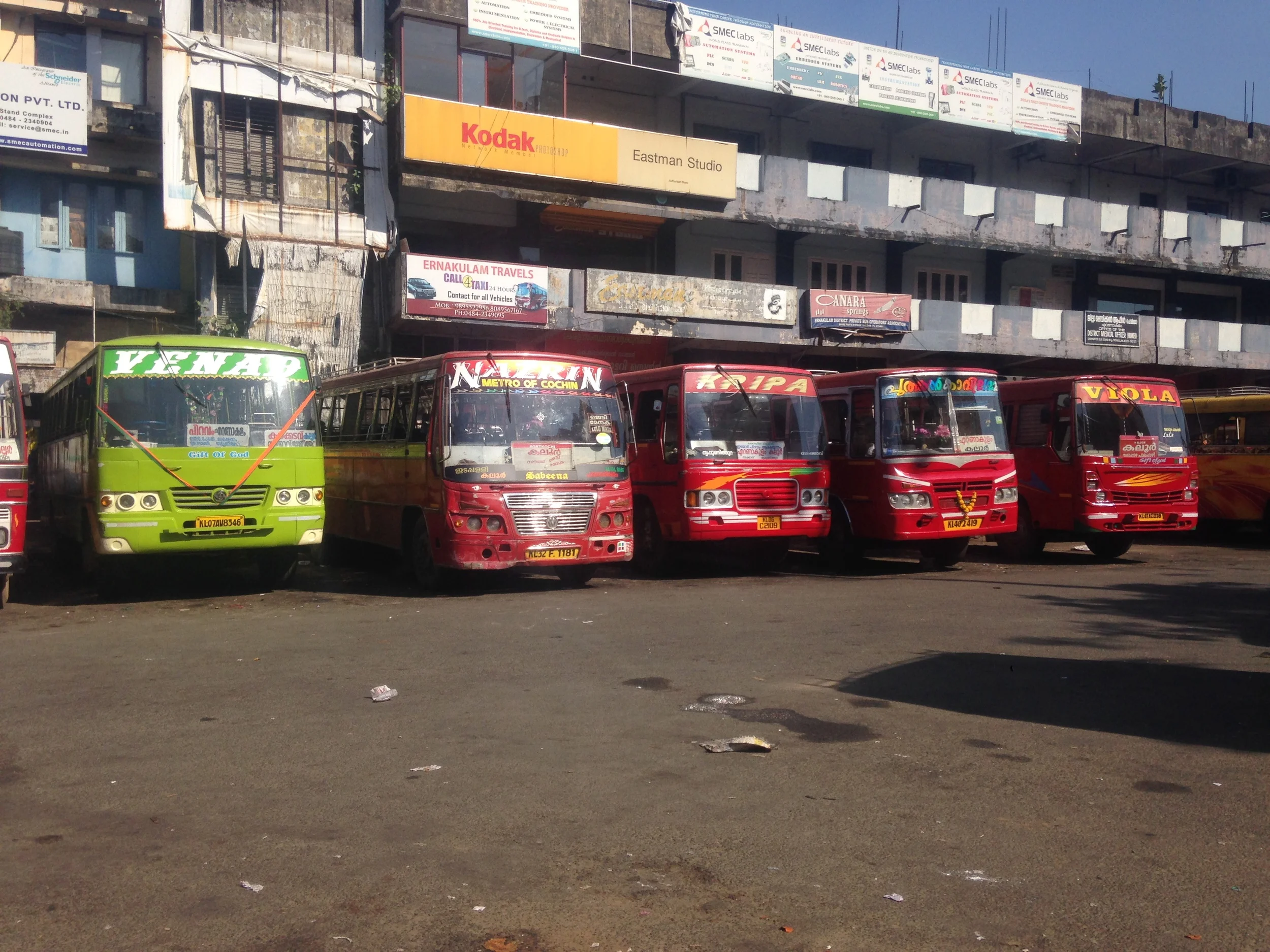 Red buses (and one green) of Kochi.