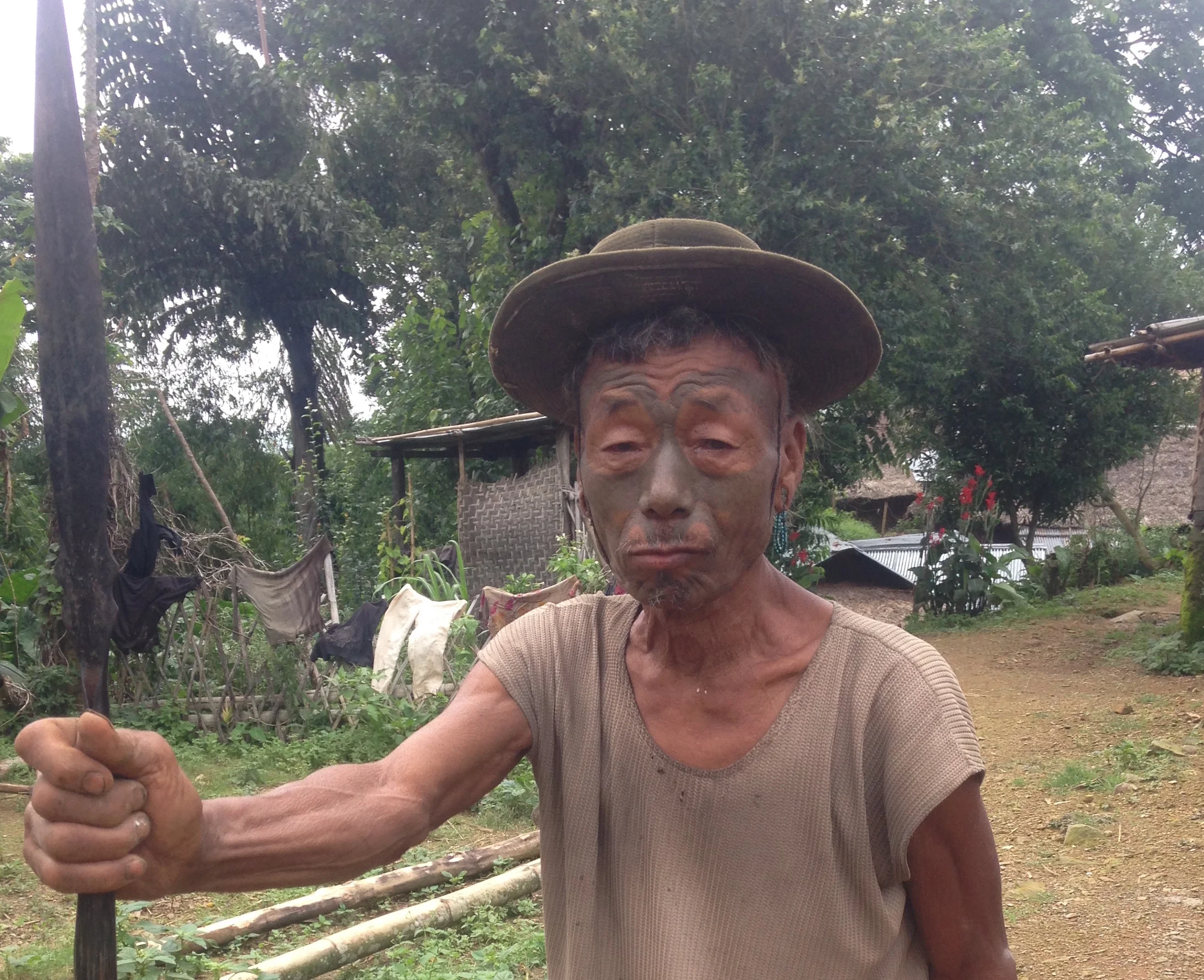 Chiangkem of Longwa Village, one of the few remaining face tattooed Naga warriors.