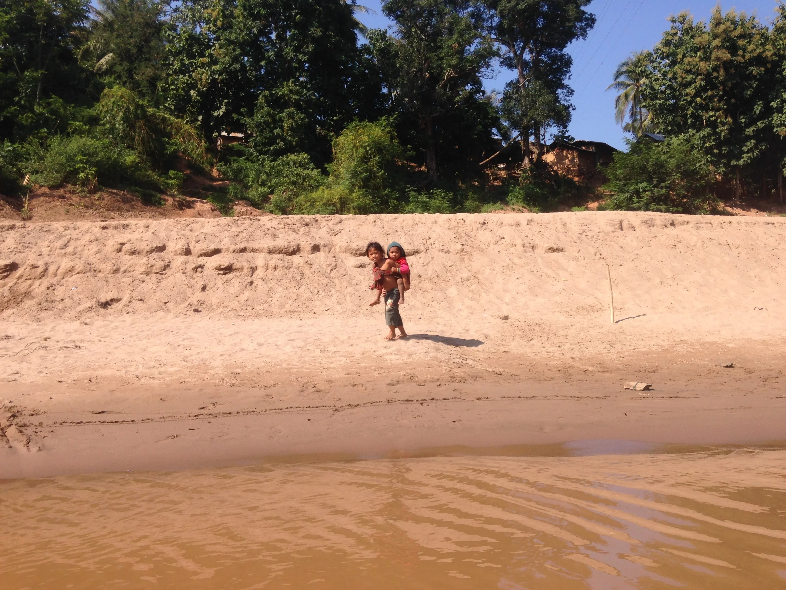 Children coming to greet their father who was on the boat with me