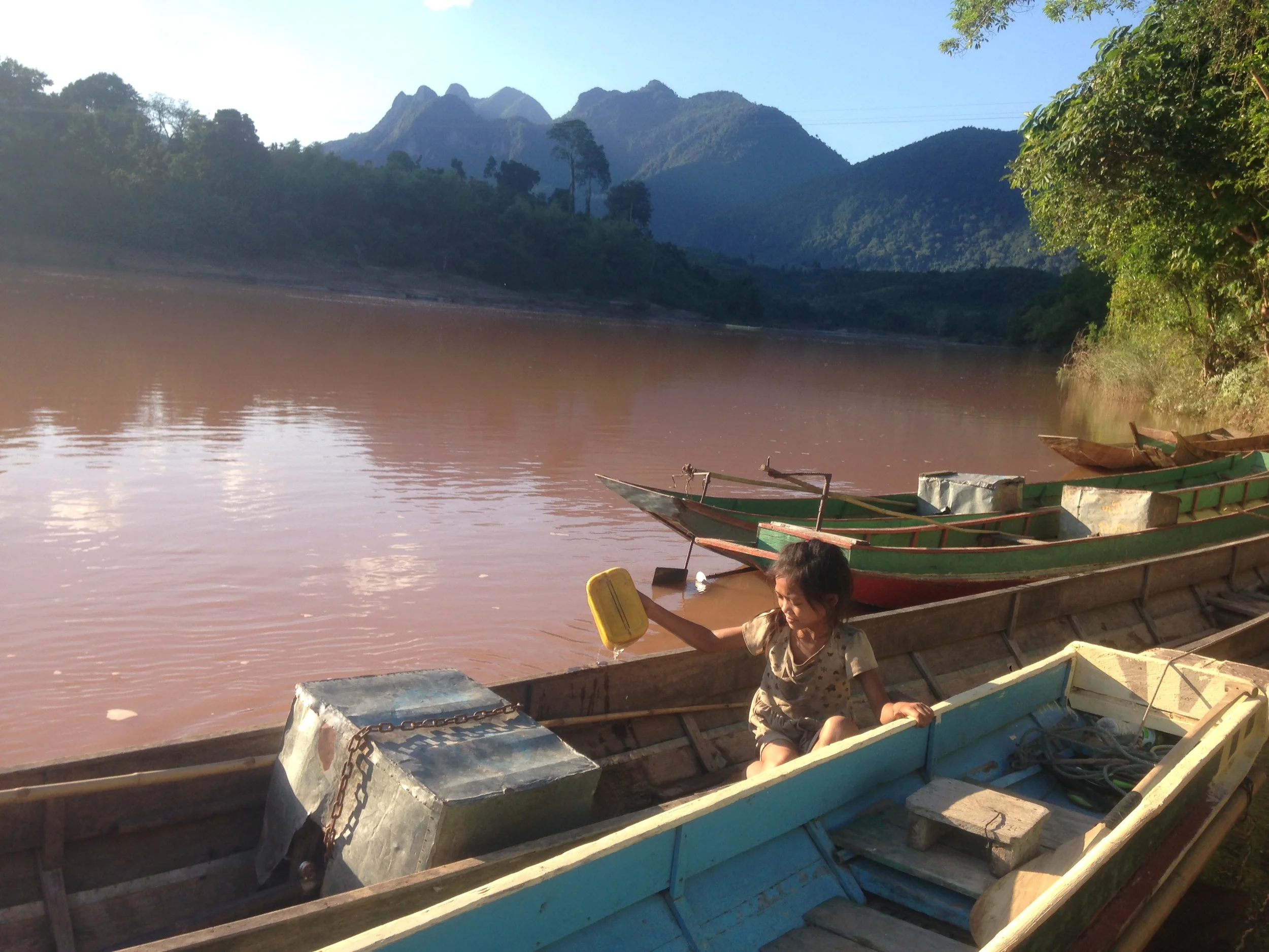 Bailing water out of a boat on the Nam Ou