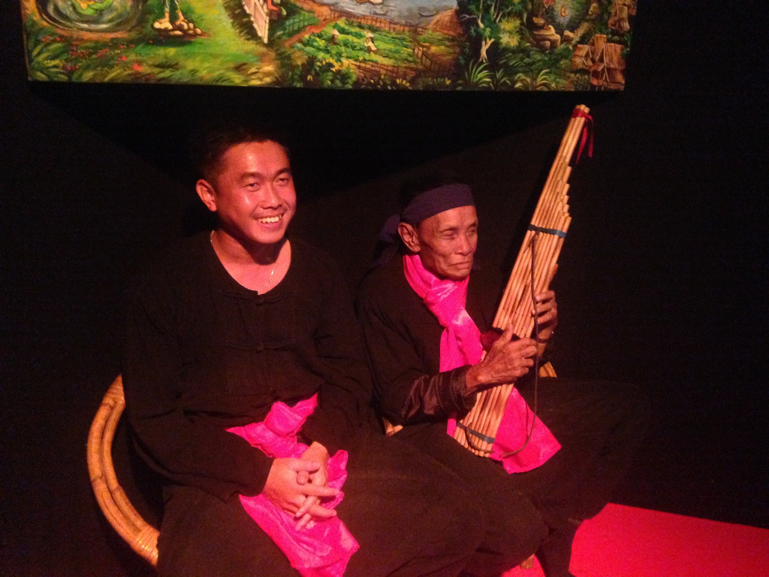  Two performers telling stories and playing traditional music in Luang Prabang 