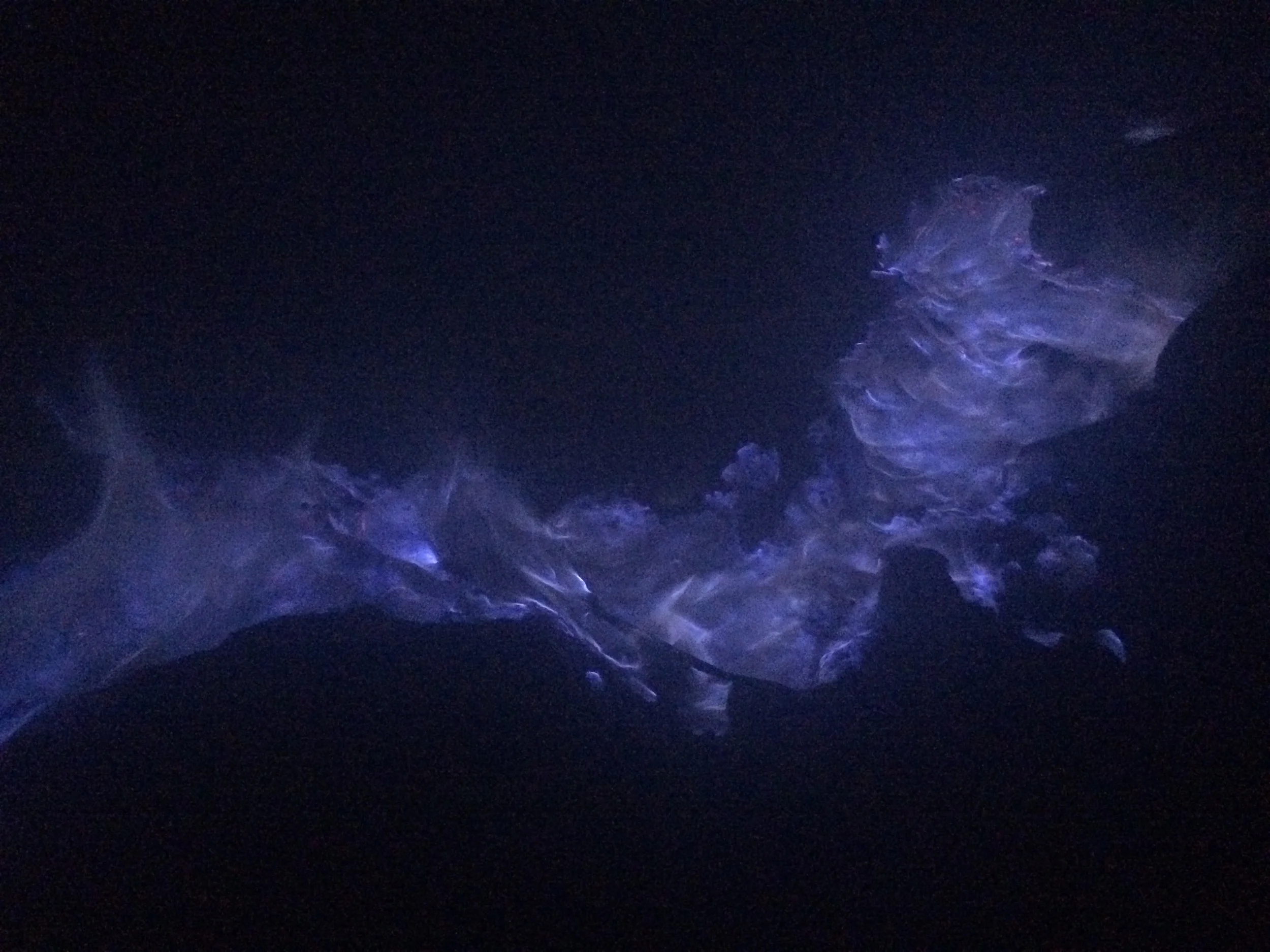 A close up of a trail of blue flame
