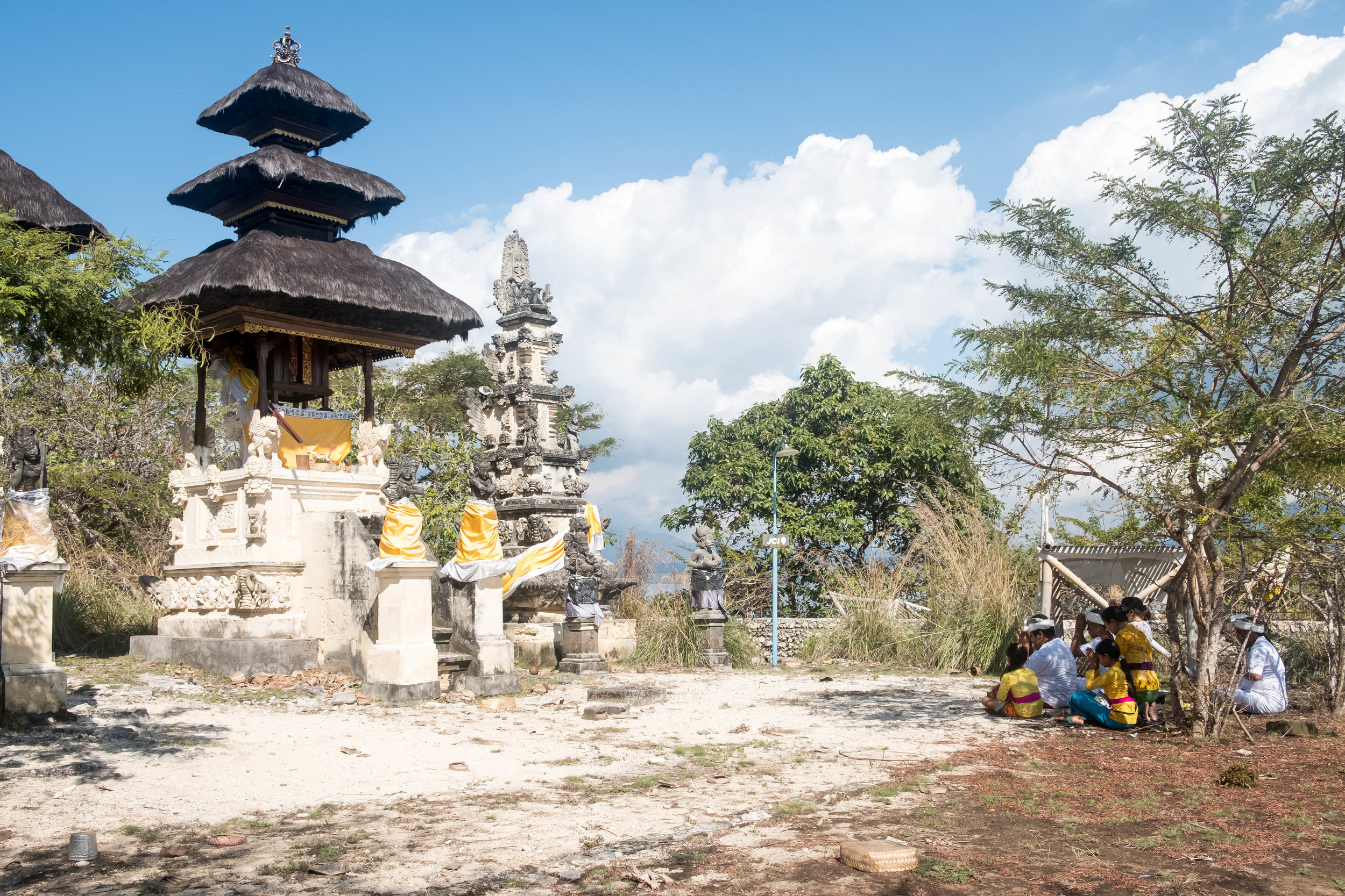 Balinese family praying