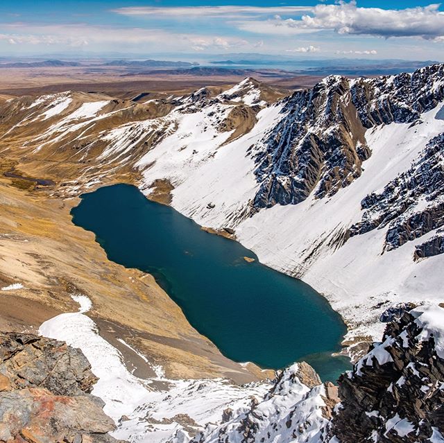 Lake Juri Khota seen from the peak of Cerro Austria (5330m) and Lake Titicaca in the distance. +Beautiful peaks of the Cordillera Real. #bolivia #cordillerareal #laketiticaca #photography #travel #travelledworld #travelphotography #landscape #nature 