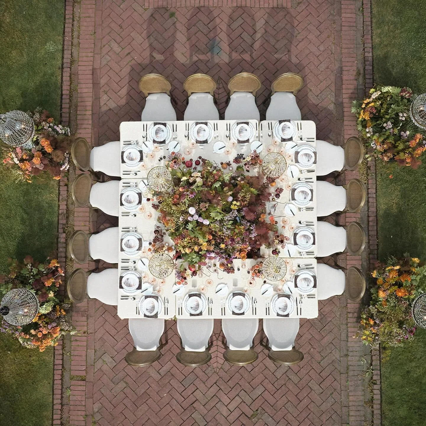 Something I loved about this shoot was how it aimed to elevate the classic chateau look. So instead of a simple floral centerpiece, I created a floral meadow in the middle of all the tables. Each seated guest gets their own unique view of a larger, m