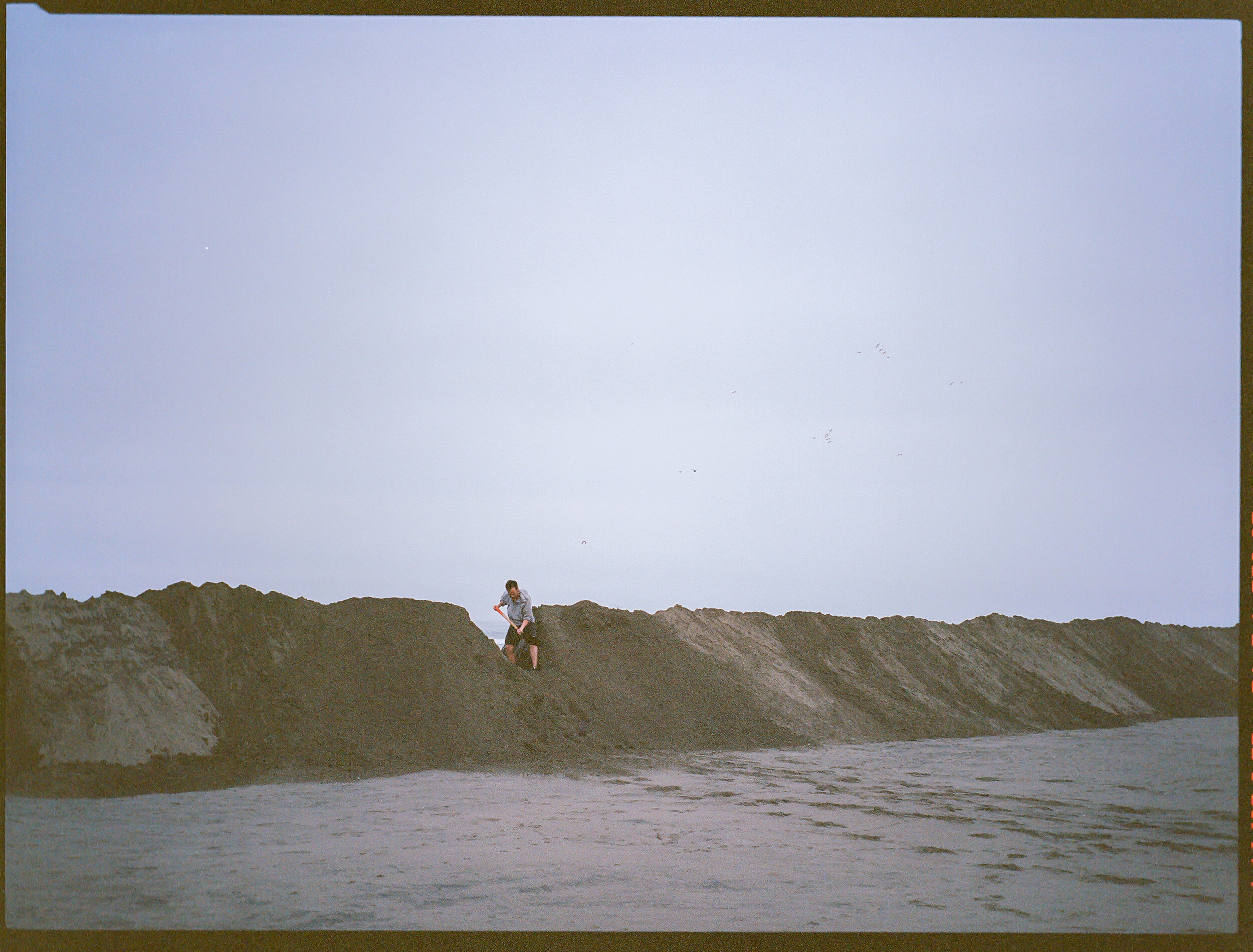BREACH is a durational performance that seeks to question society’s impact on the natural world. Digging non stop for 3 hours, Iván Sikic creates a gap on an artificial sand dune that has been erected to protect the coast where it is situated, from
