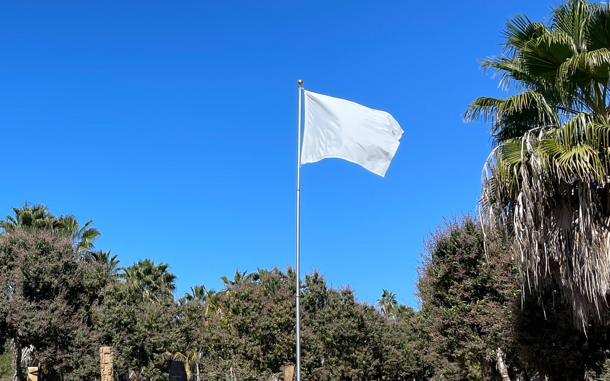 Some Things Are Best Left Unsaid (2023) is a provocative and timely body of work that explores the complex relationship between power, censorship, and artistic expression. Consisting of four flags, this installation embodies both the resilienc