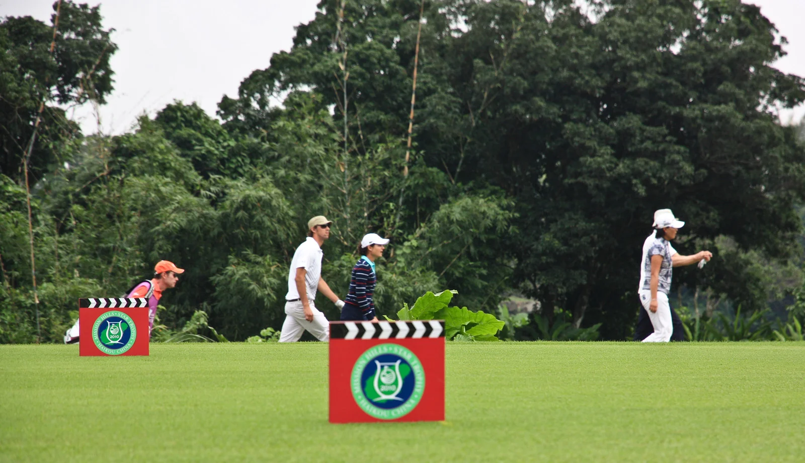 Michael Phelps and Lorena Ochoa walking past the 10th tee