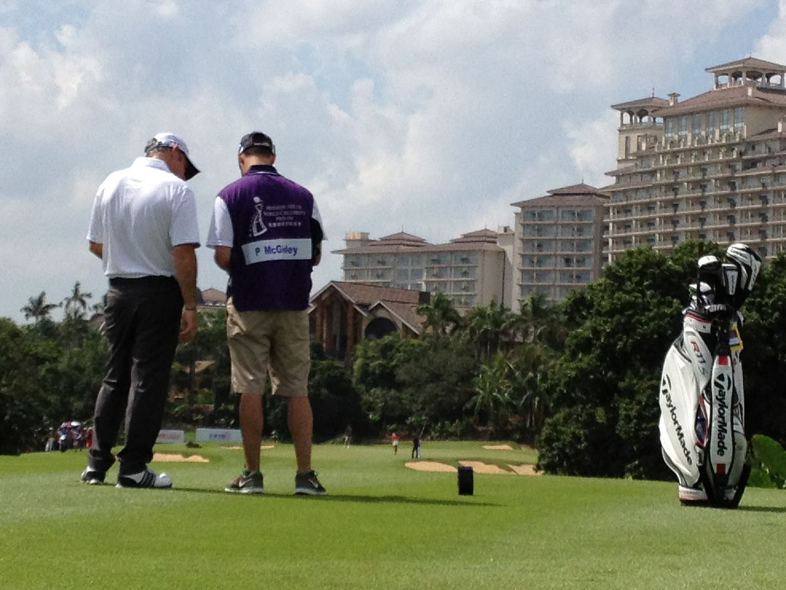 On the bag and checking yardages into the par 3 8th.