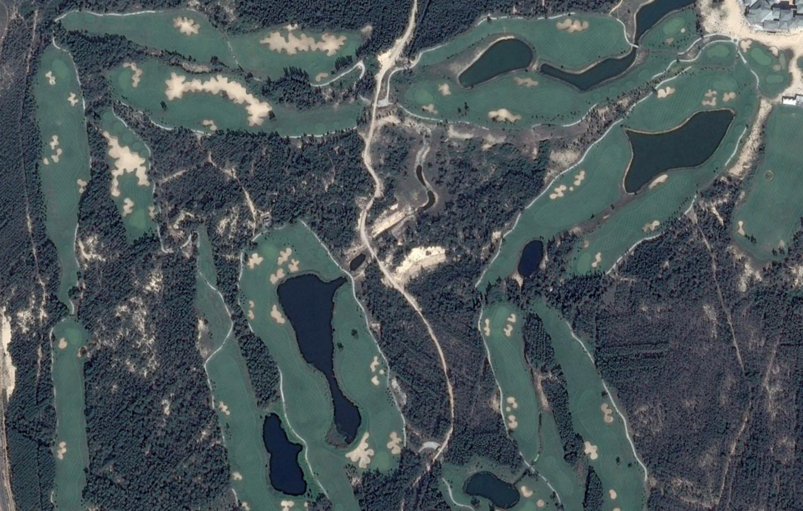 Aerial View of the "other" course featuring numerous lakes and cookie cutter bunkering