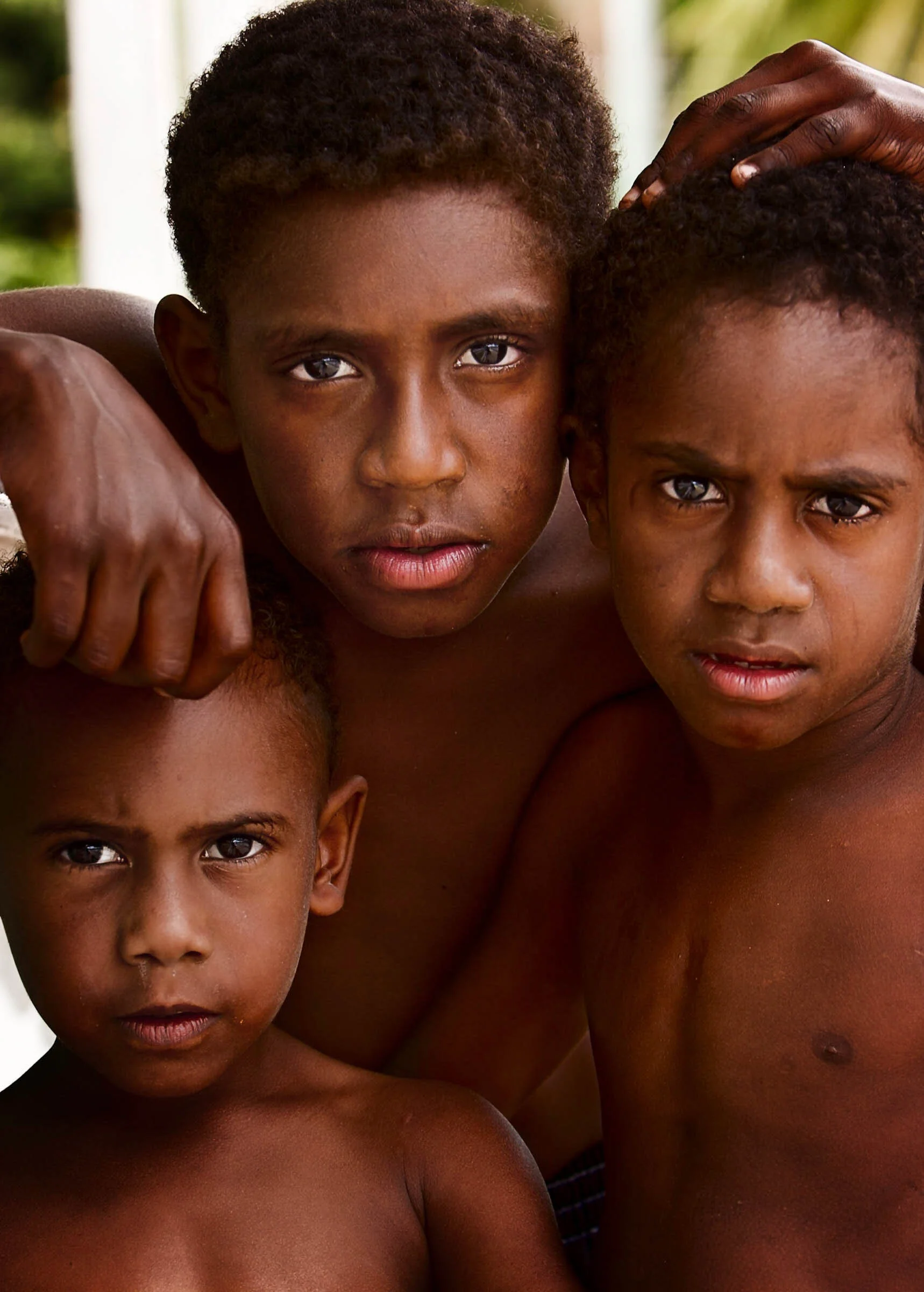 Portrait of three young Torres Straight Islander boys. 
