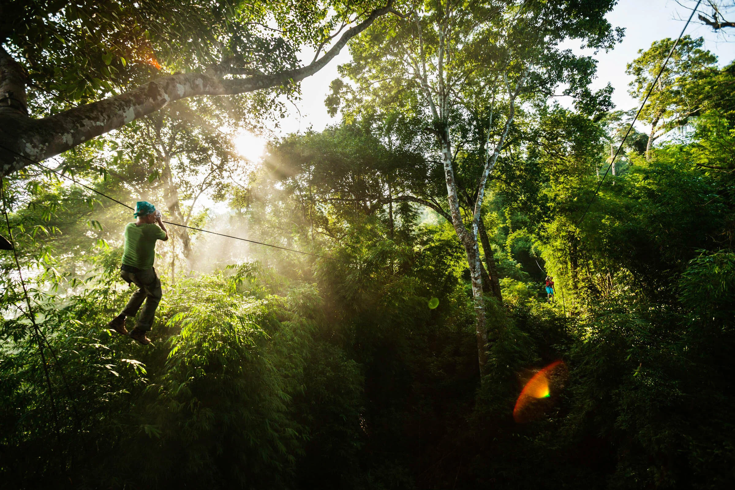  Sunrise as tourists zip line from tree houses amongst the canopy at The Gibbon Experience, Huay Xai, Laos. 