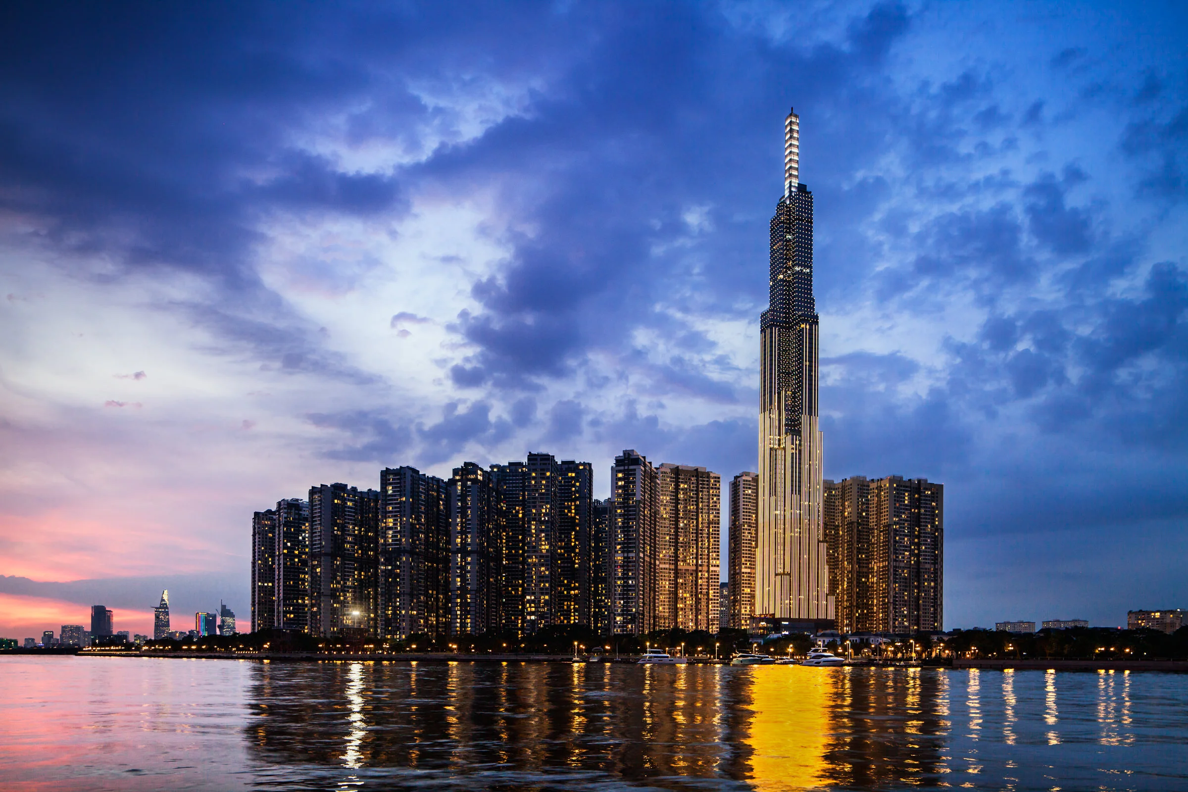 Riverside view of Vincom Landmark 81 tower at dusk in Ho Chi Minh City, Vietnam. 