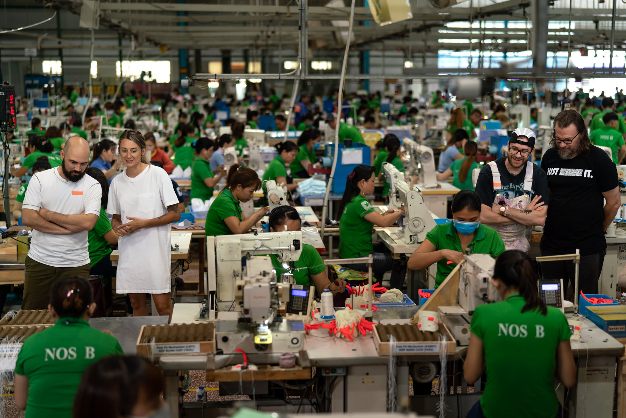  Noah, Haley, James and “Sneakerologist” Bryan Farris walk the production line as the shoes come to life at the factory. 