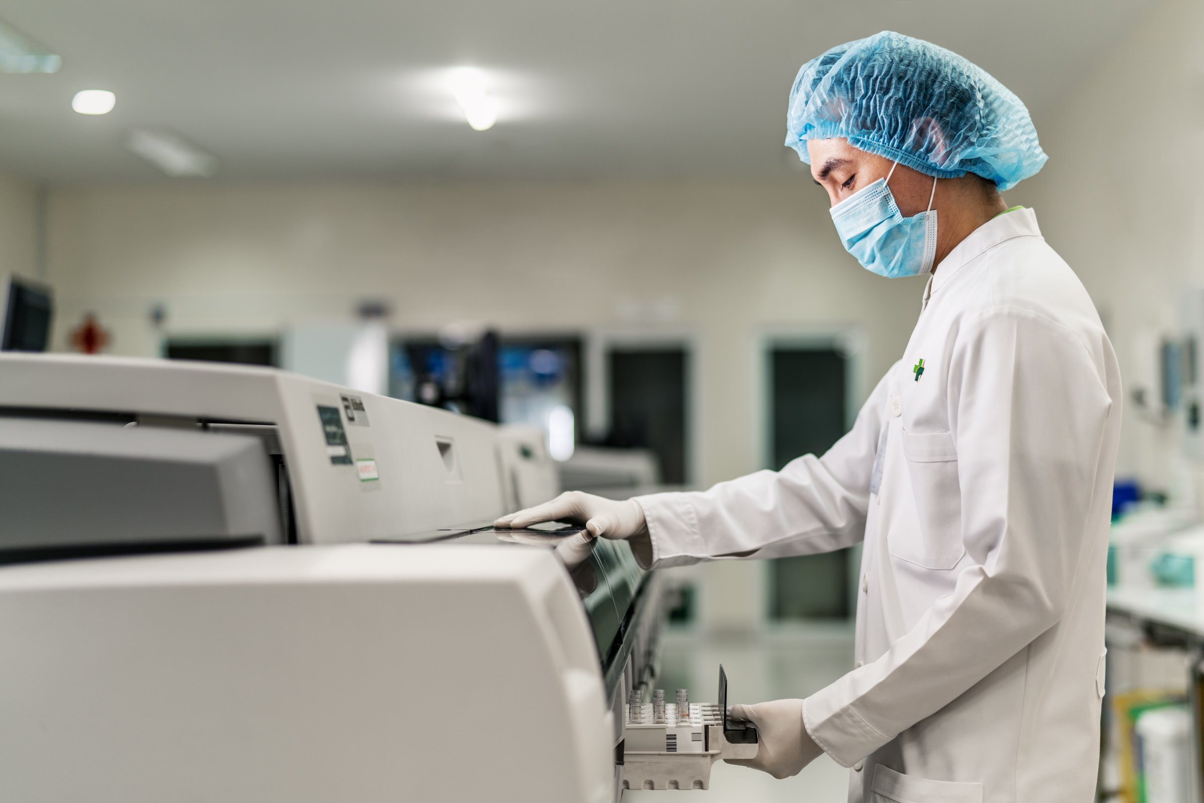 A lab technician performs pathology testing at Hoan My Saigon.