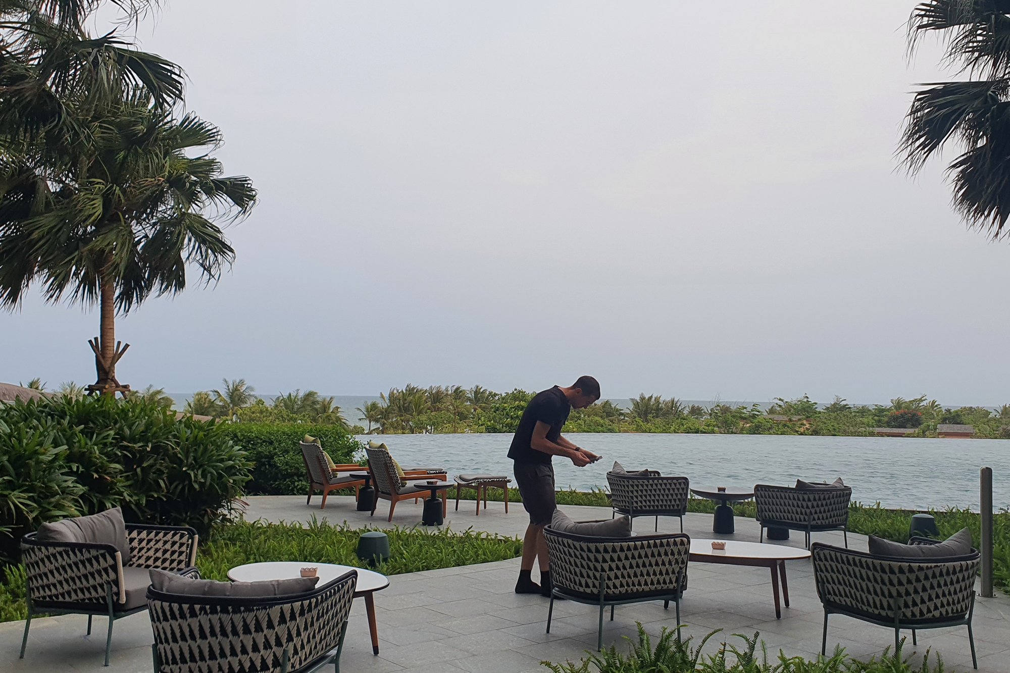  Behind the scenes as photographer Tim Gerard Barker arranges furniture at The Common, New World Hoiana Beach Resort. 