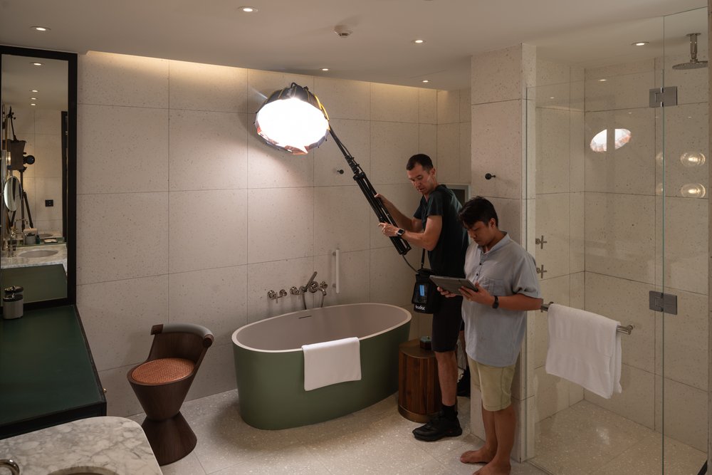  Behind the scenes as photographer Tim Gerard Barker light paints while capturing interior images at New World Hoiana Beach Resort. 