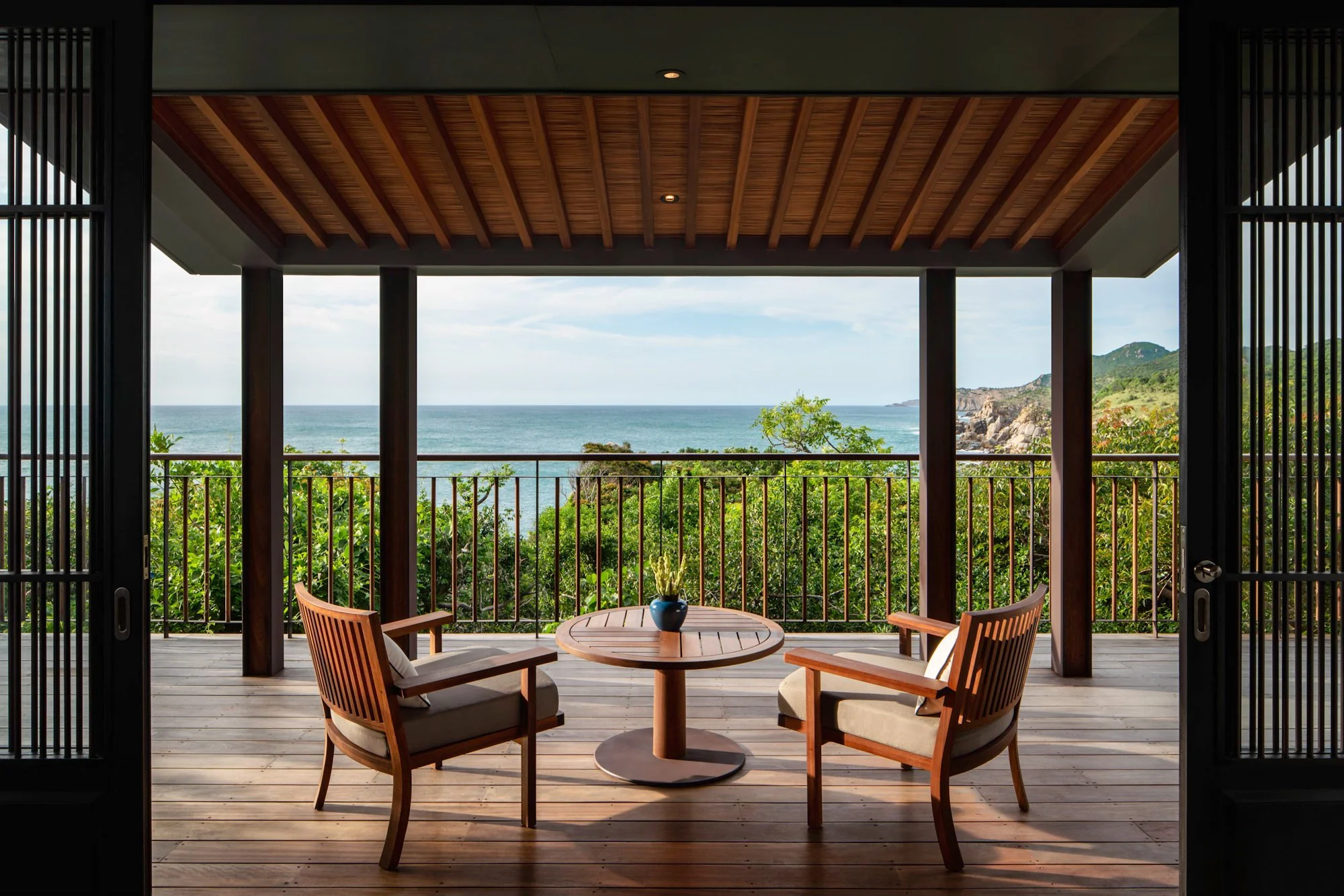  Table and chairs on Amanoi residence bedroom decking with sea view. 