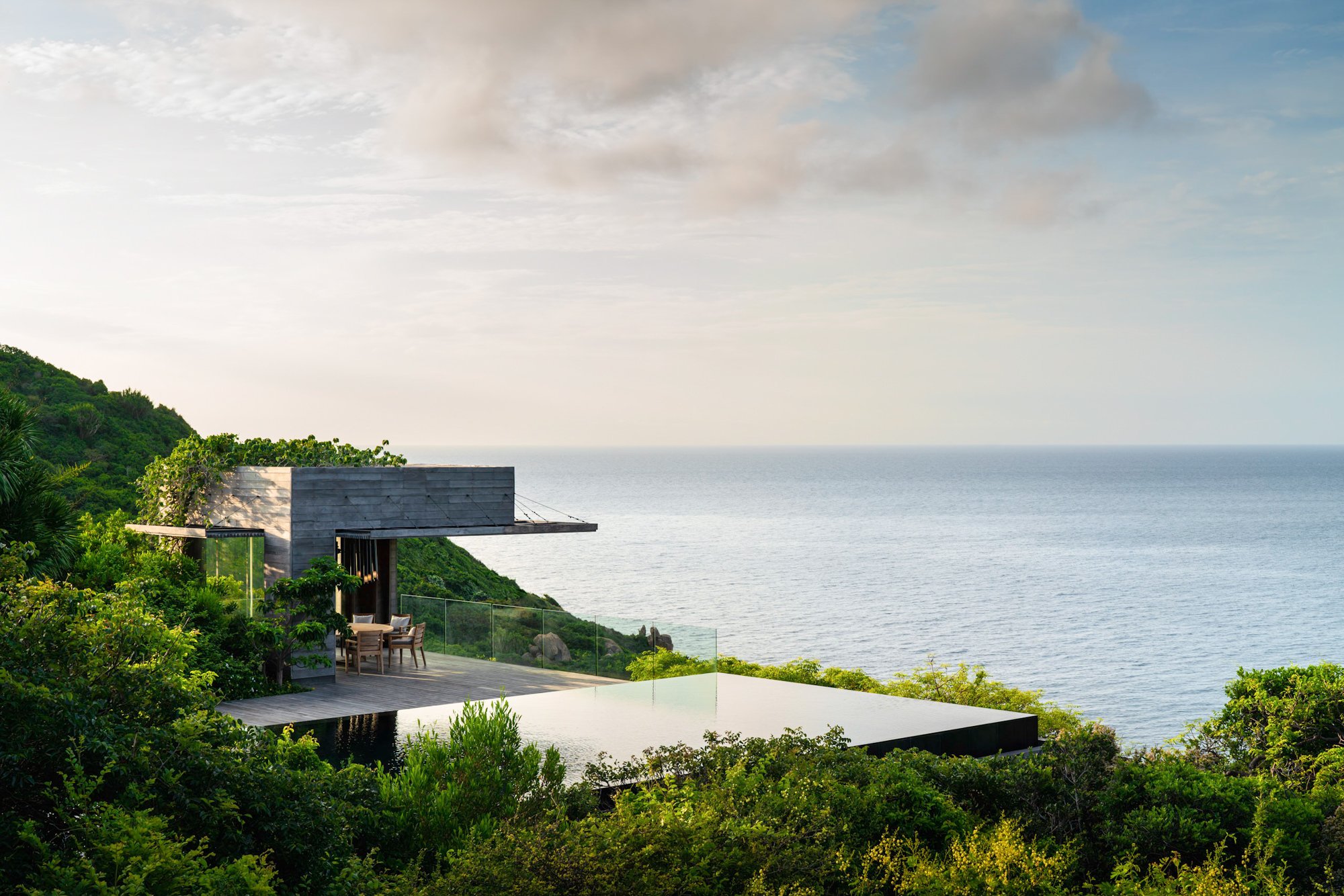  Large infinity pool and outdoor dining gazebo on spacious decking at Amanoi Resort Residence. 