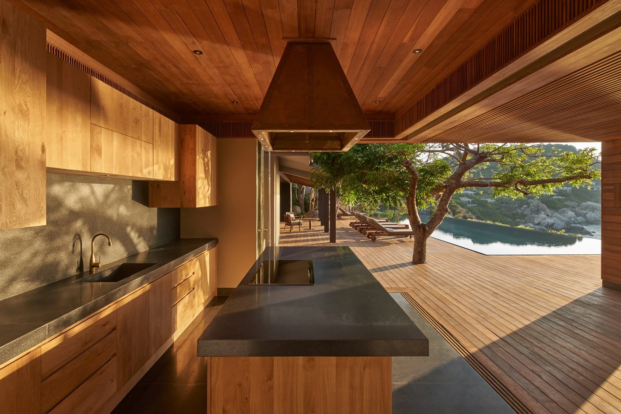  Amanoi Ocean Pool Residence with open-air kitchen and dining pavilion overlooking the infinity pool, ocean and surrounding forest. 