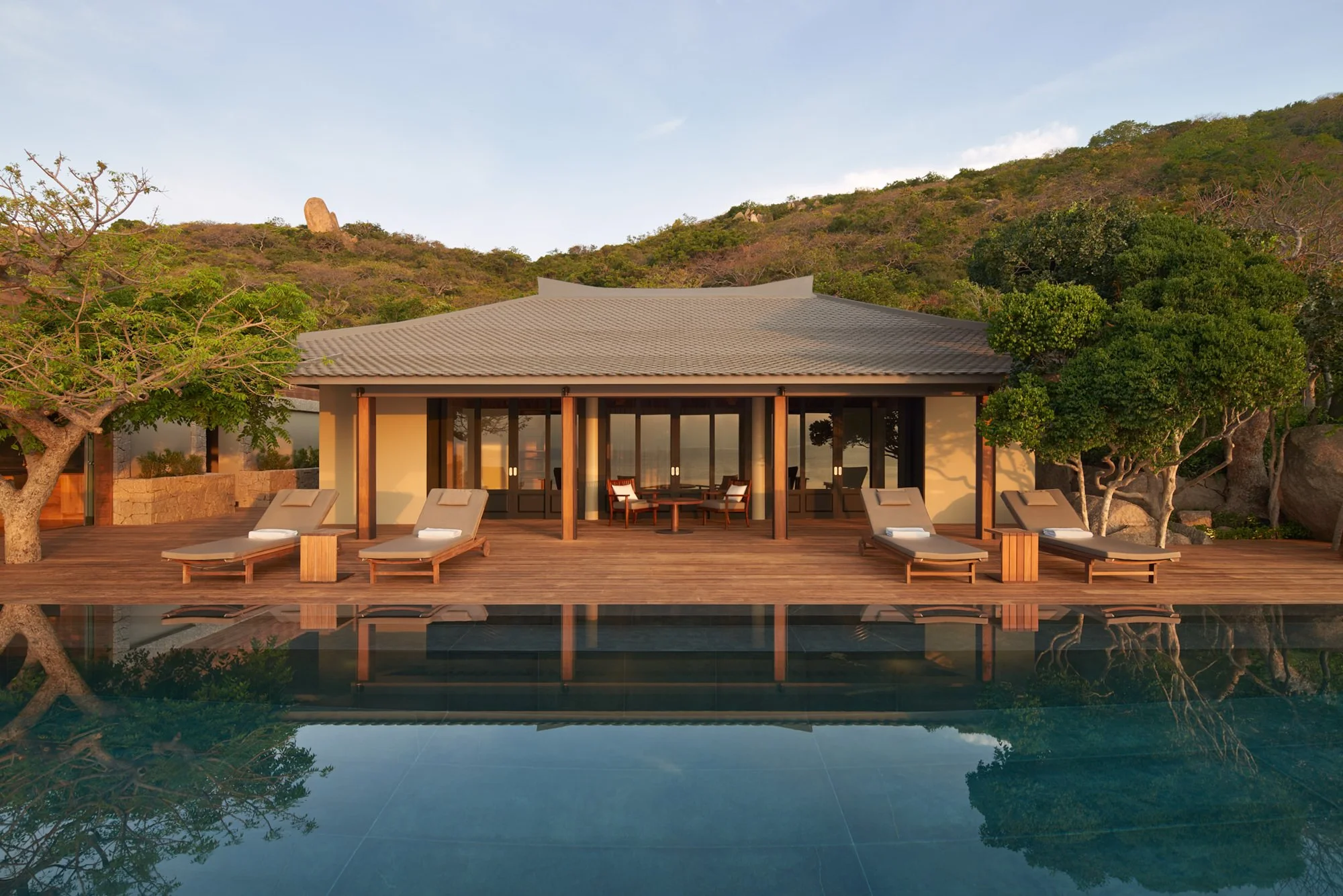  Amanoi Ocean Pool Residence with open-air kitchen and dining pavilion overlooking the infinity pool, ocean and surrounding forest. 