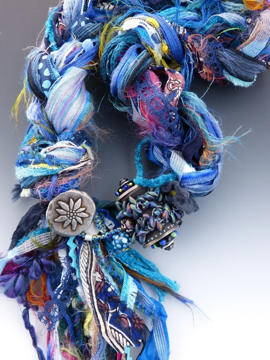 Indigo Blue Fiber Necklace with Riveted Wooden Spool and Lampwork Glass Detail