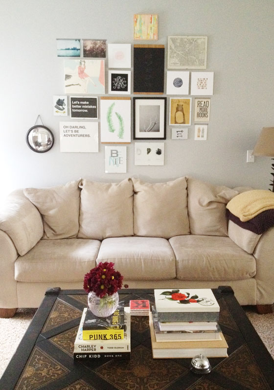 Not that you have to frame everything in your gallery wall, but be wary of making it too casual. Also, this is a classic example both of poor spacing and poor proportioning. The content is solid, but a few inches of spacing and some frames would really take this gallery up a notch.