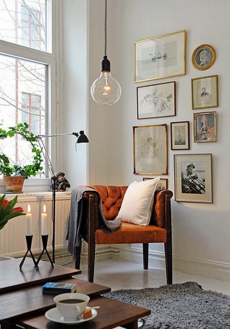 Not all displays have to be oriented horizontally. If you have a thin segment of wall to cover, consider stacking your pieces in columns rather than lining them up in rows. I also love the vintage theme of this gallery. If you have amazing old frames or classic photos of your grandparents or great-grandparents, this sort of gallery would be the perfect inspiration.